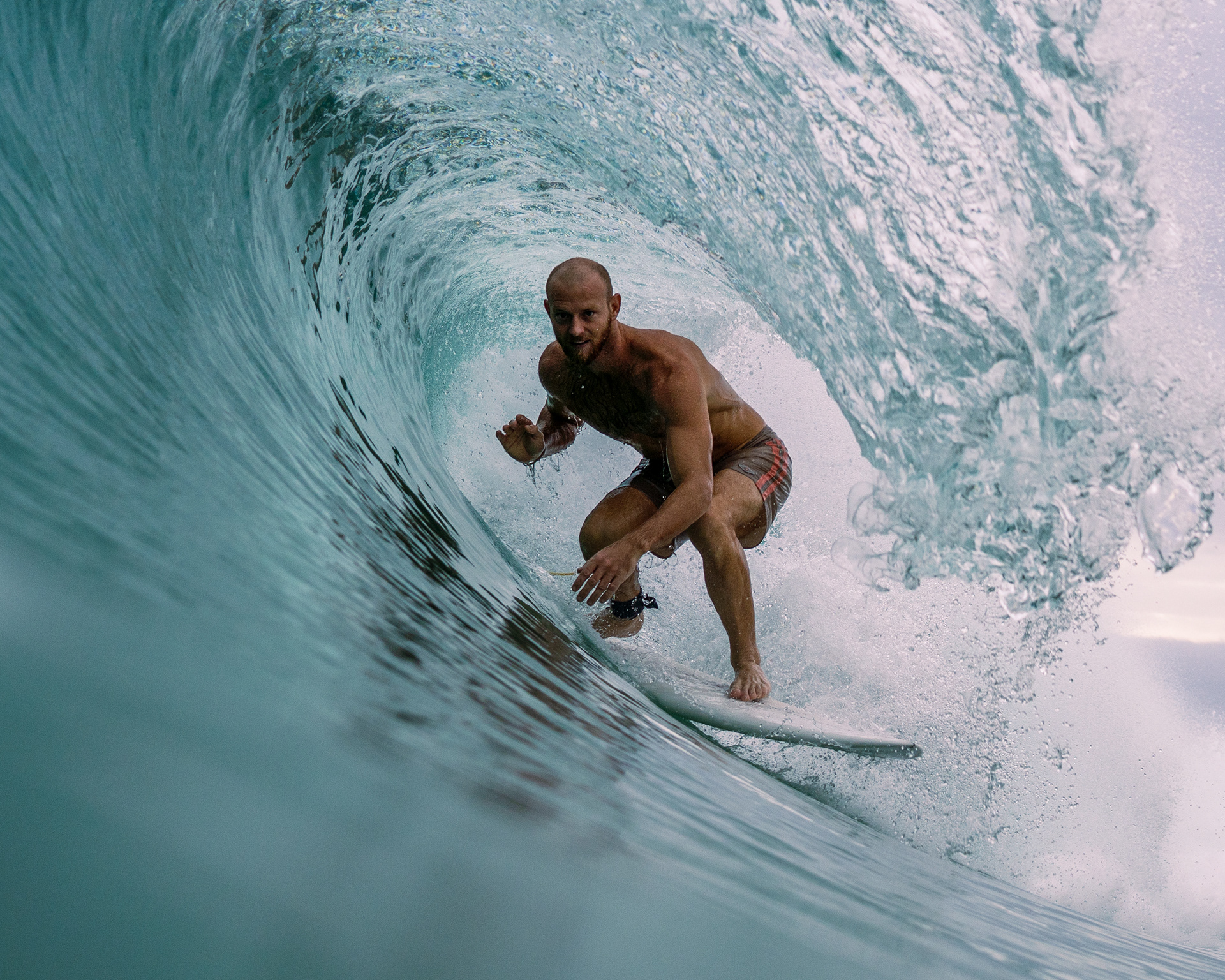 Jacob Mellish riding a shortboard through a perfect barrel in Ahangama, Sri Lanka
