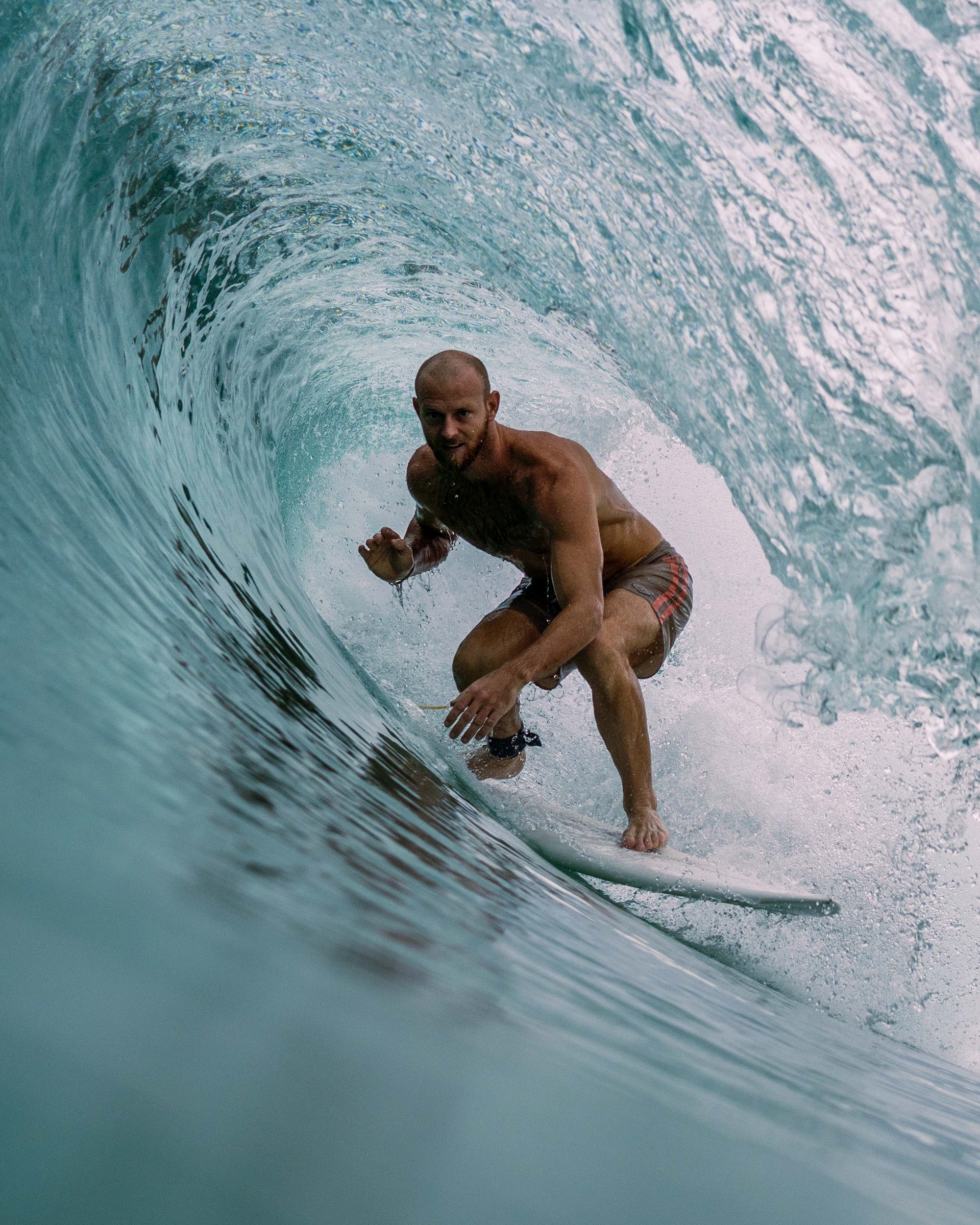 Jacob Mellish riding a shortboard through a perfect barrel in Ahangama, Sri Lanka