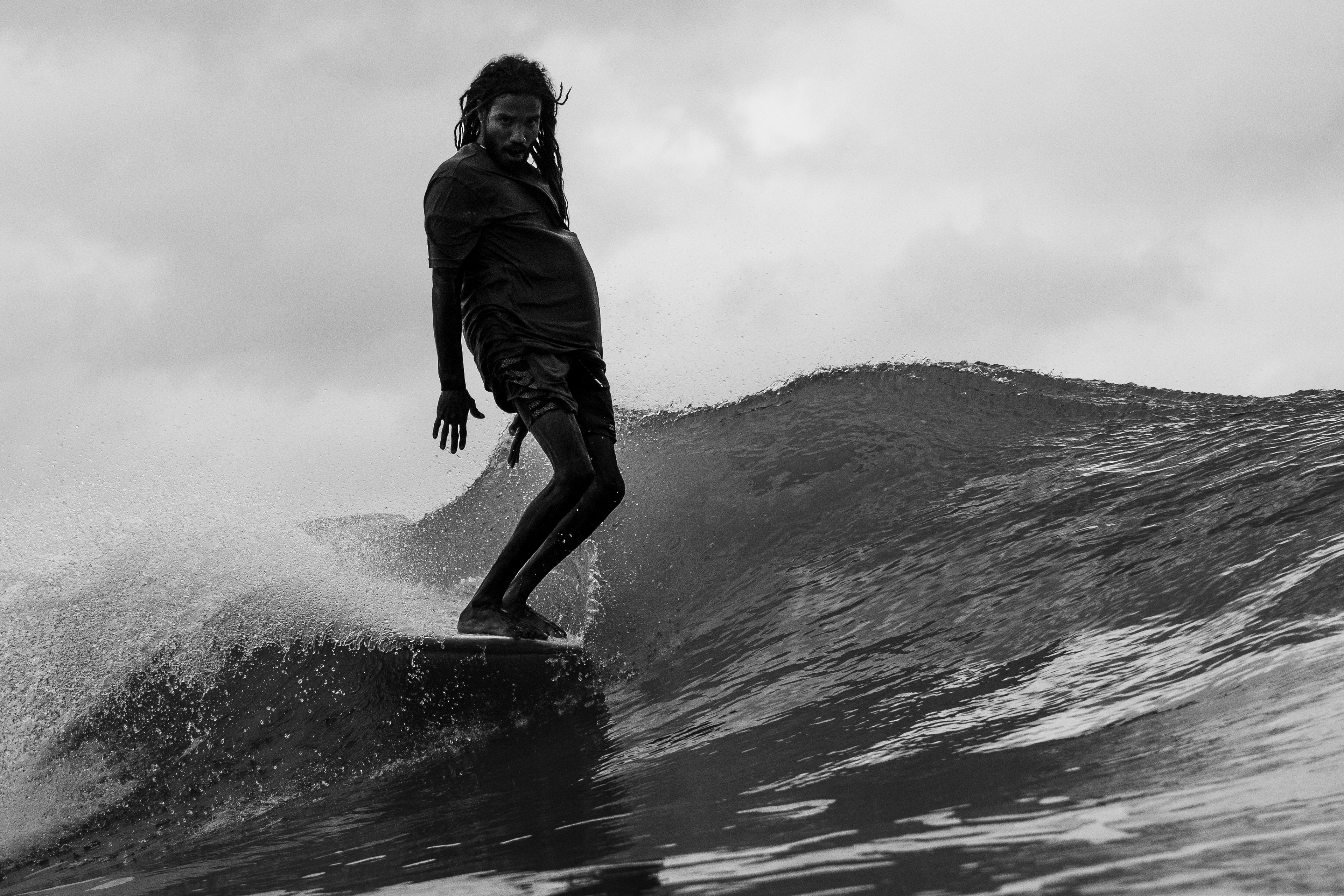 Surf Coach Kavishka x Ceylon Sliders captured longboarding at Weligama Taprobane Island