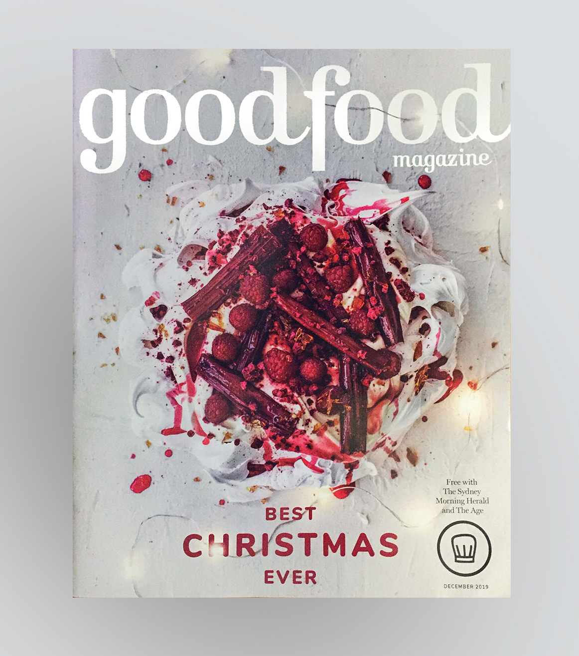 Good food magazine Christmas cover design showing a pavlova with fairy lights