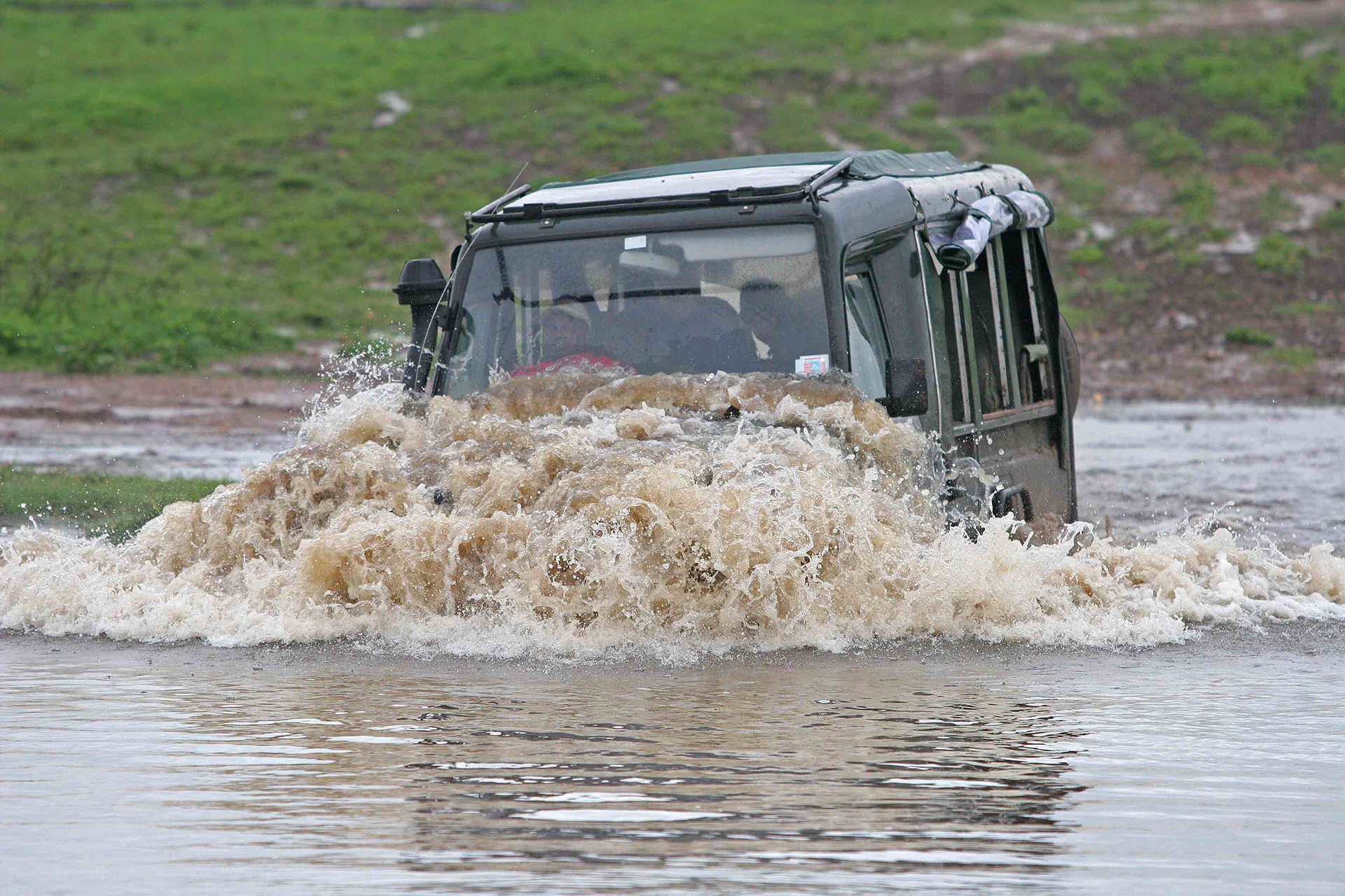 Crossing a flooded stream during the El Nino rains - Masai Mara