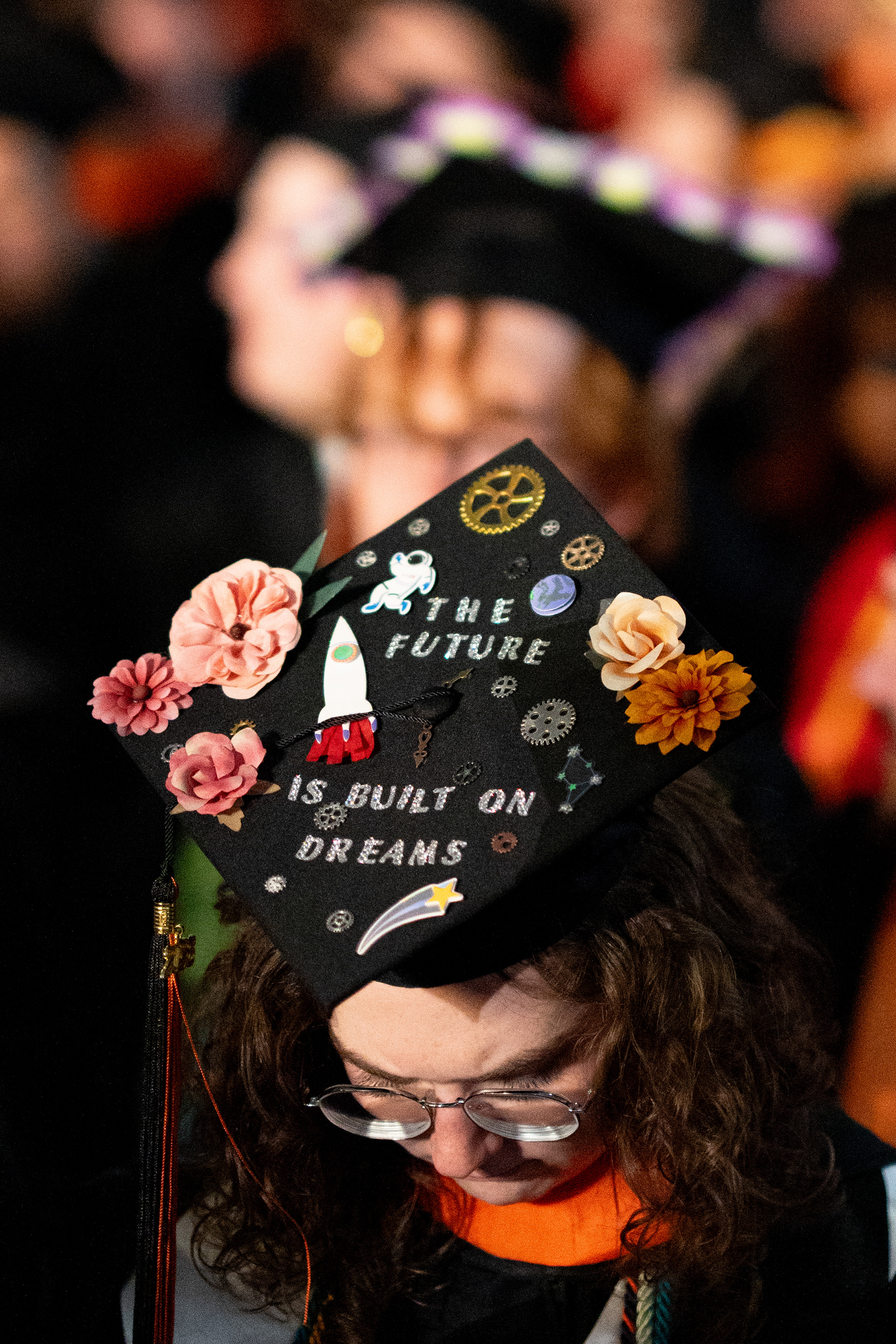 A graduate’s cap is decorated with flowers, gears, a rocket and the words “The future is built on dreams” during the 2026 Academic Convocation in the Gordon Field House at the Rochester Institute of Technology in Henrietta, N.Y., Friday, May 8, 2026.