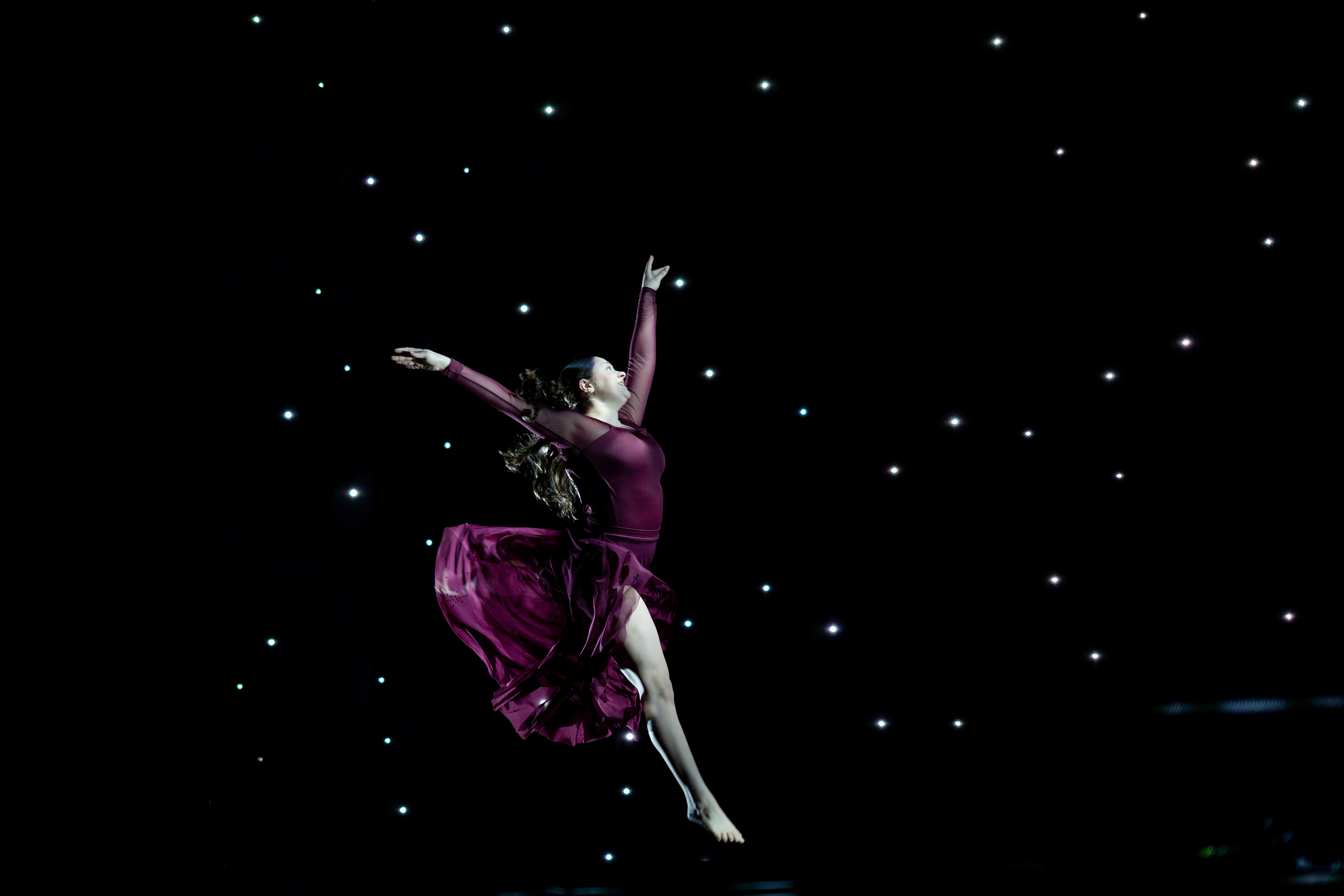 RIT student Emerson Pearlberg leaps through the air during the “Till There Was You” dress rehearsal in RIT’s Performing Arts Center on April 8, 2026.