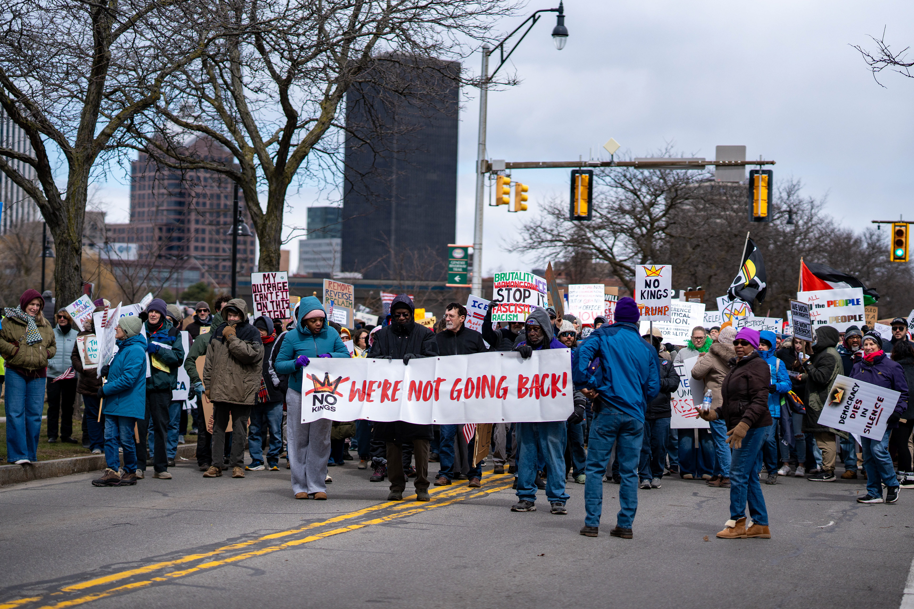 Demonstrators carrying a banner reading “We’re not going back!” begin a march from Genesee Gateway Park during a No Kings protest in Rochester, N.Y., Saturday, March 28, 2026.