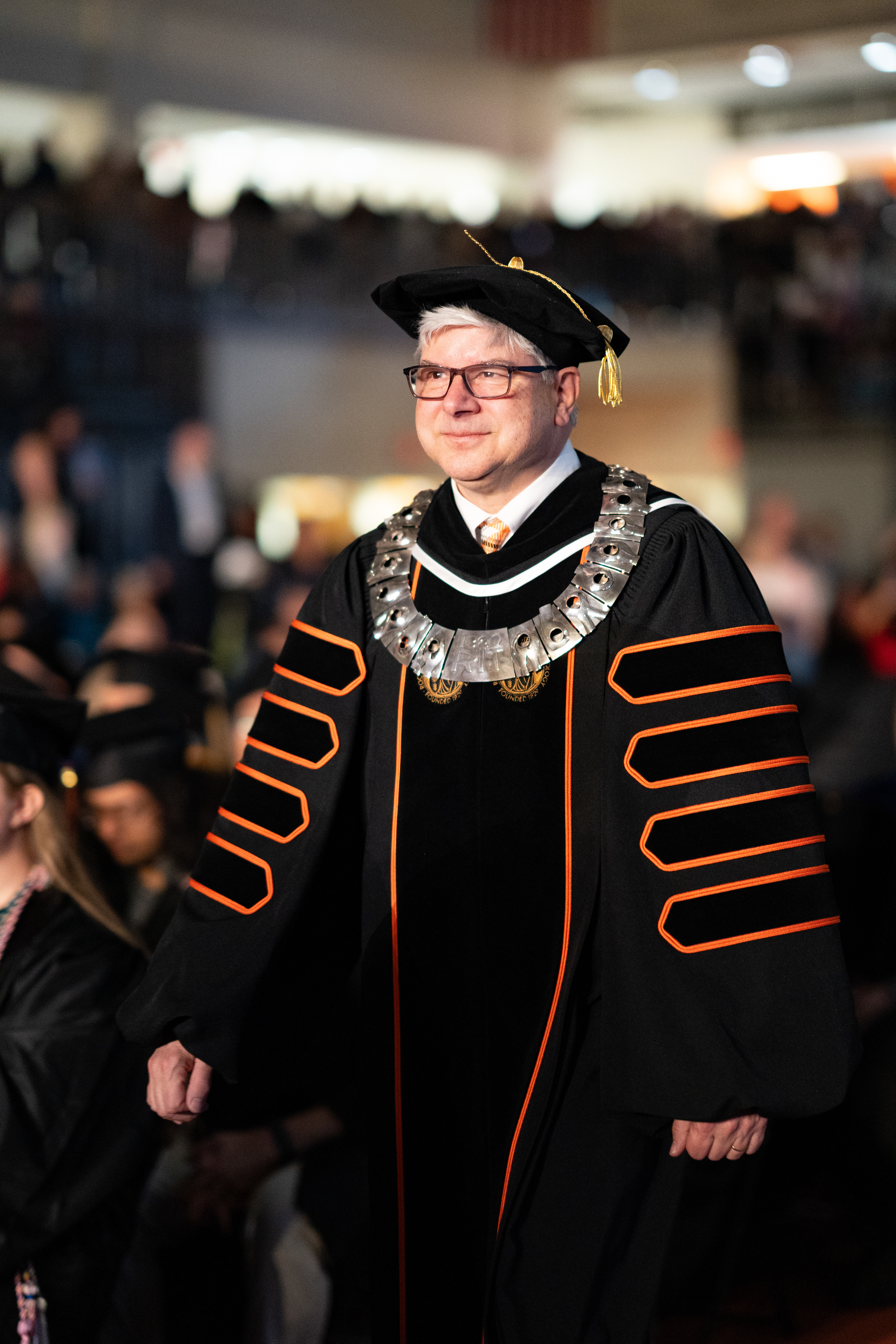 RIT President William H. Sanders, wearing the Presidential Collar of Authority, walks to the stage during the 2026 Academic Convocation in the Gordon Field House at the Rochester Institute of Technology in Henrietta, N.Y., Friday, May 8, 2026.