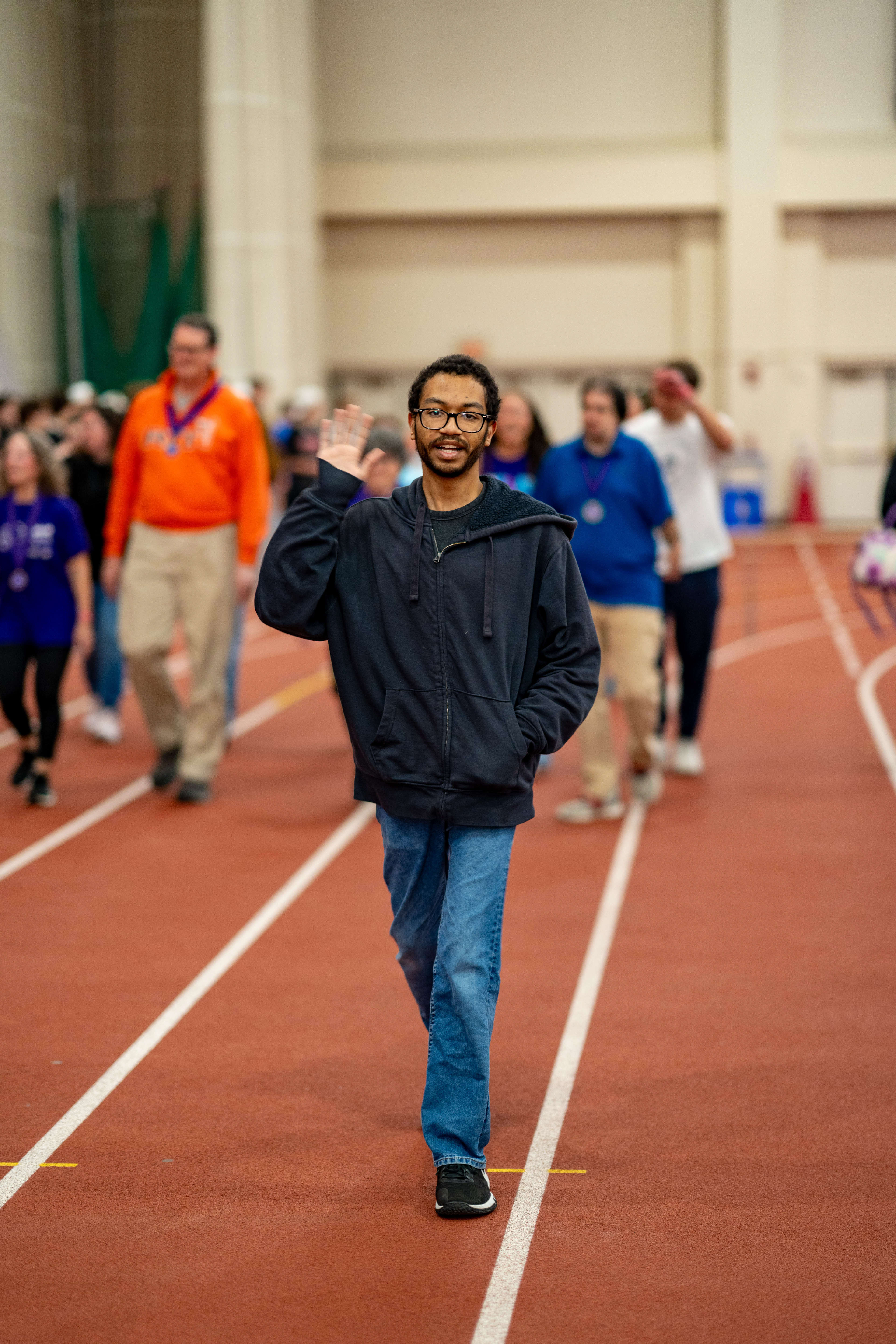 RIT student and cancer survivor Dominic Verdun walks with fellow survivors during the opening survivors lap of Relay For Life in the Gordon Field House at the Rochester Institute of Technology in Henrietta, N.Y., Saturday, April 11, 2026.