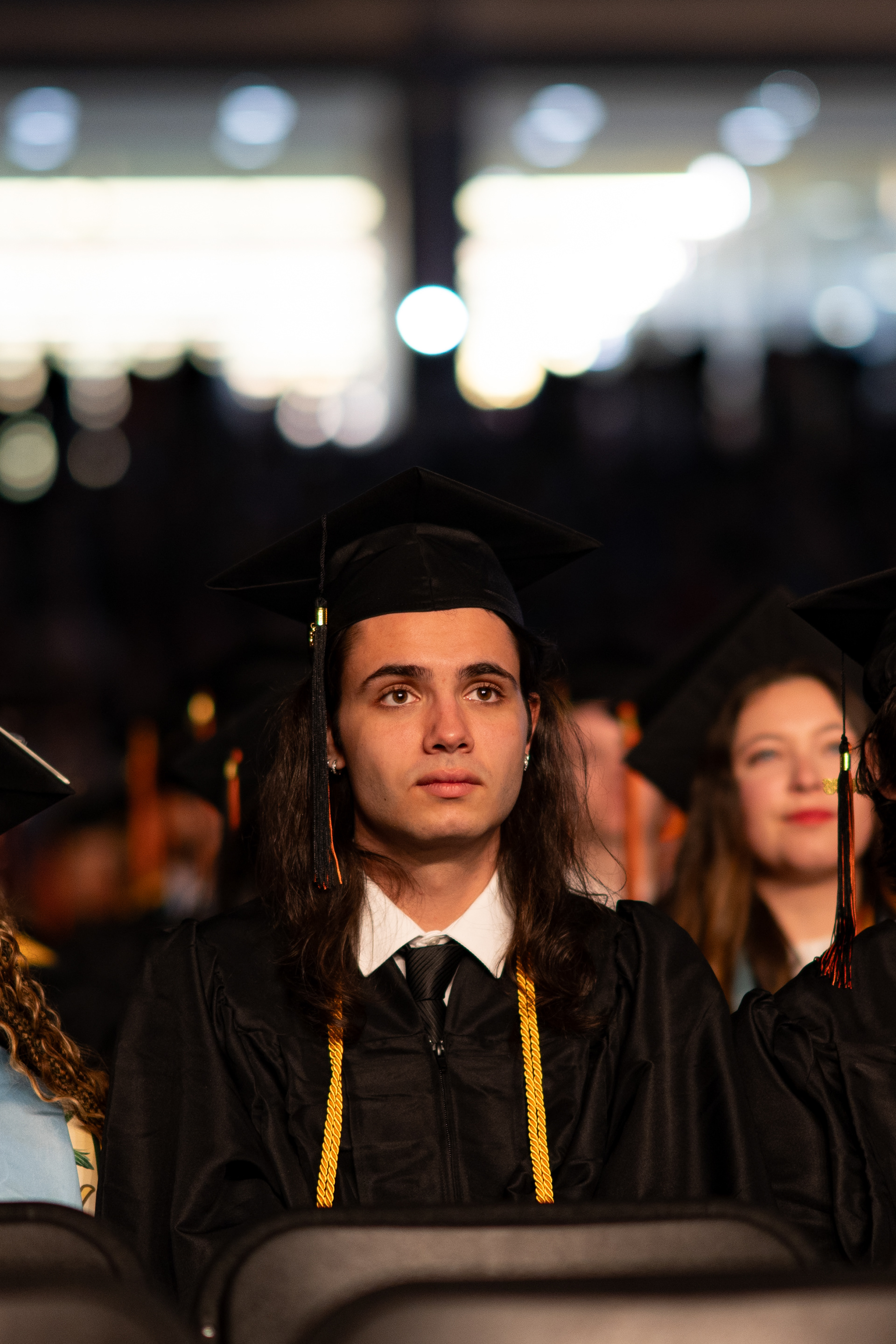 Graduating RIT student Justin Beardsley looks toward the stage during the 2026 Academic Convocation in the Gordon Field House at the Rochester Institute of Technology in Henrietta, N.Y., Friday, May 8, 2026.