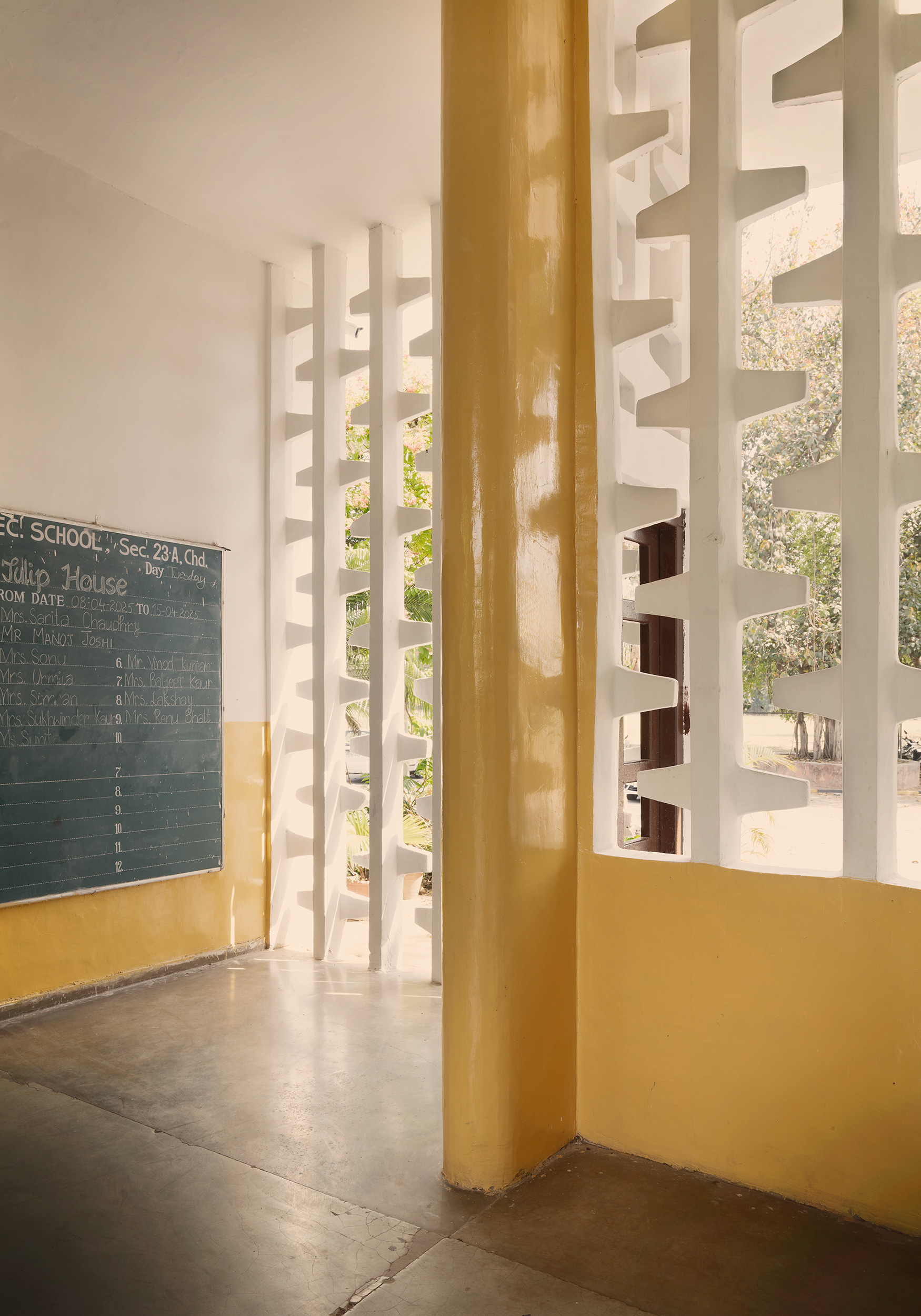Government Model Senior Secondary School. The school designed by Jane Drew in Sector 23, reflecting her interest in climate, explores the courtyard in three-dimensional configurations and different forms, functioning both as an organiser of the programme and as a space for gathering. A small square courtyard near the entrance organises the smaller classrooms; a long, narrow courtyard leads in perspective towards the main entrance and casts shadows over the large expanse of the main auditorium; while the largest courtyard, a low and wide rectangle, accommodates most of the classrooms arranged along its longer sides, also functioning as a small field for playing football or hockey.