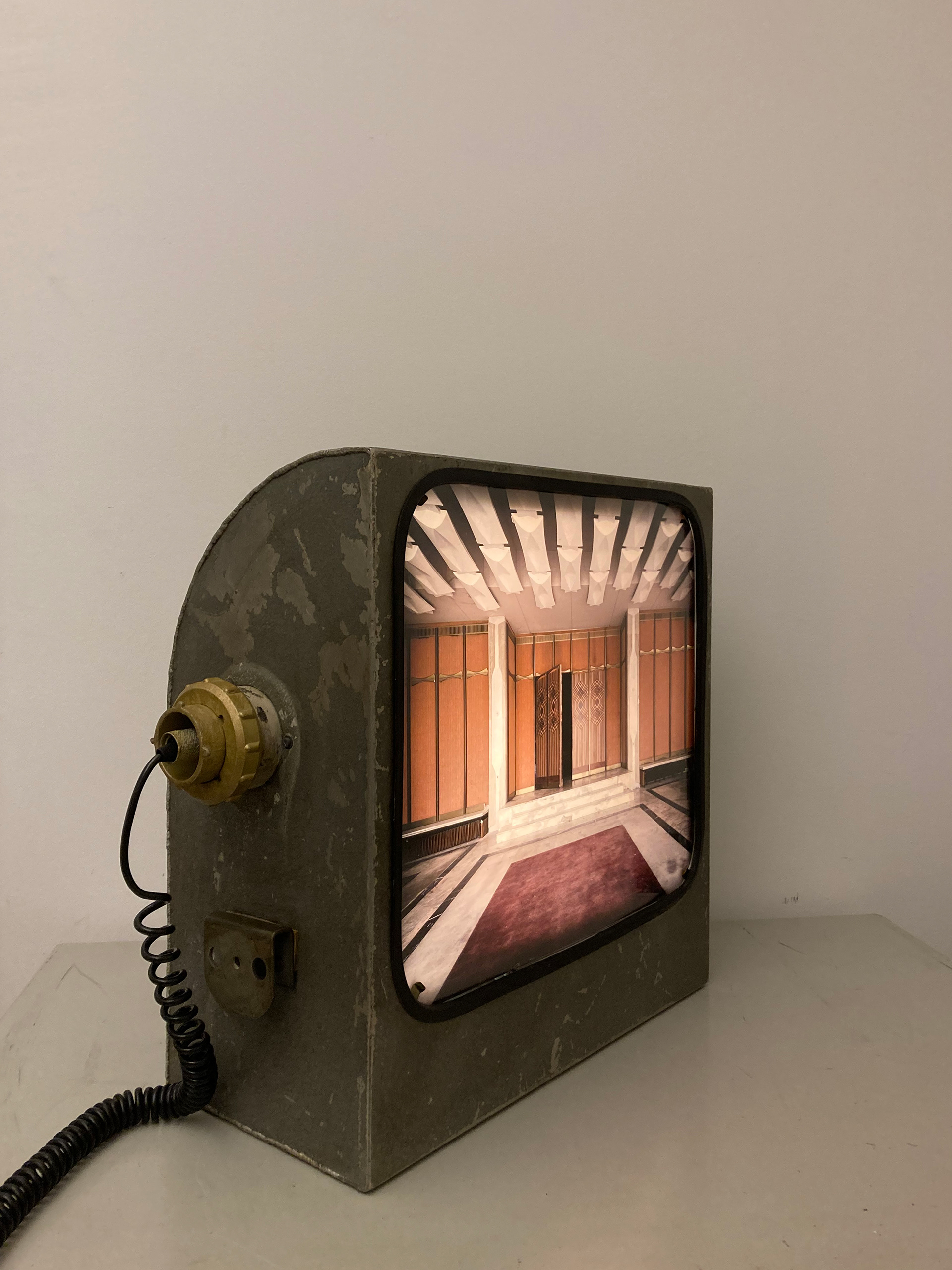 Omnia #1. Backlit photographic print. Mid-20th-century industrial projector. 52 × 50 × 24 cm. Unique piece