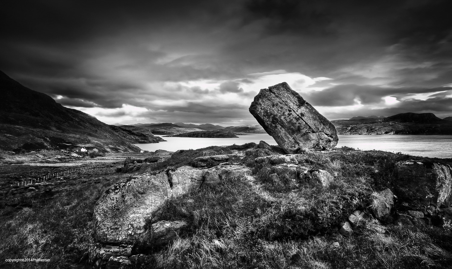 Photo of a large balanced rock on the northern scottish coast