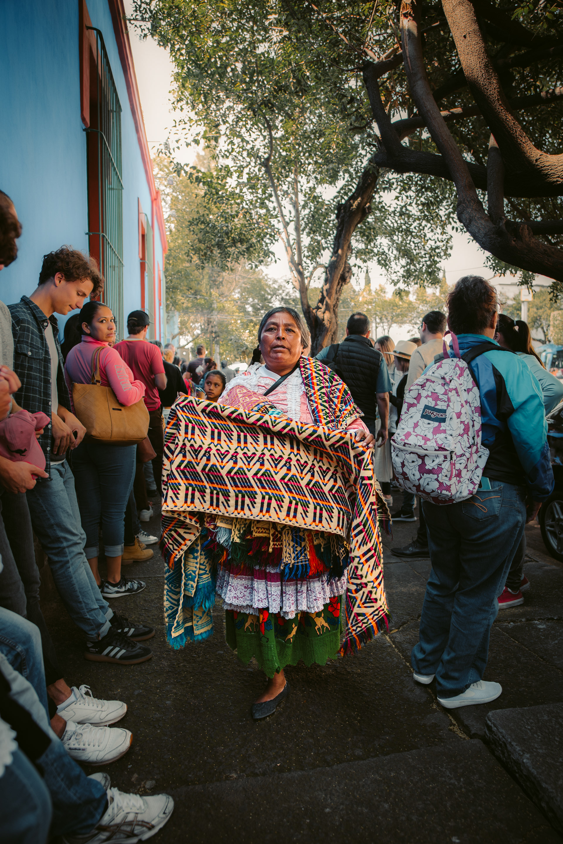 We made a 2-hour line to enter Frida Kahlo's home 'Casa Azul' when she suddenly made her way through a multitude of tourists selling Mexican textile blankets. Her monumental presence was felt.