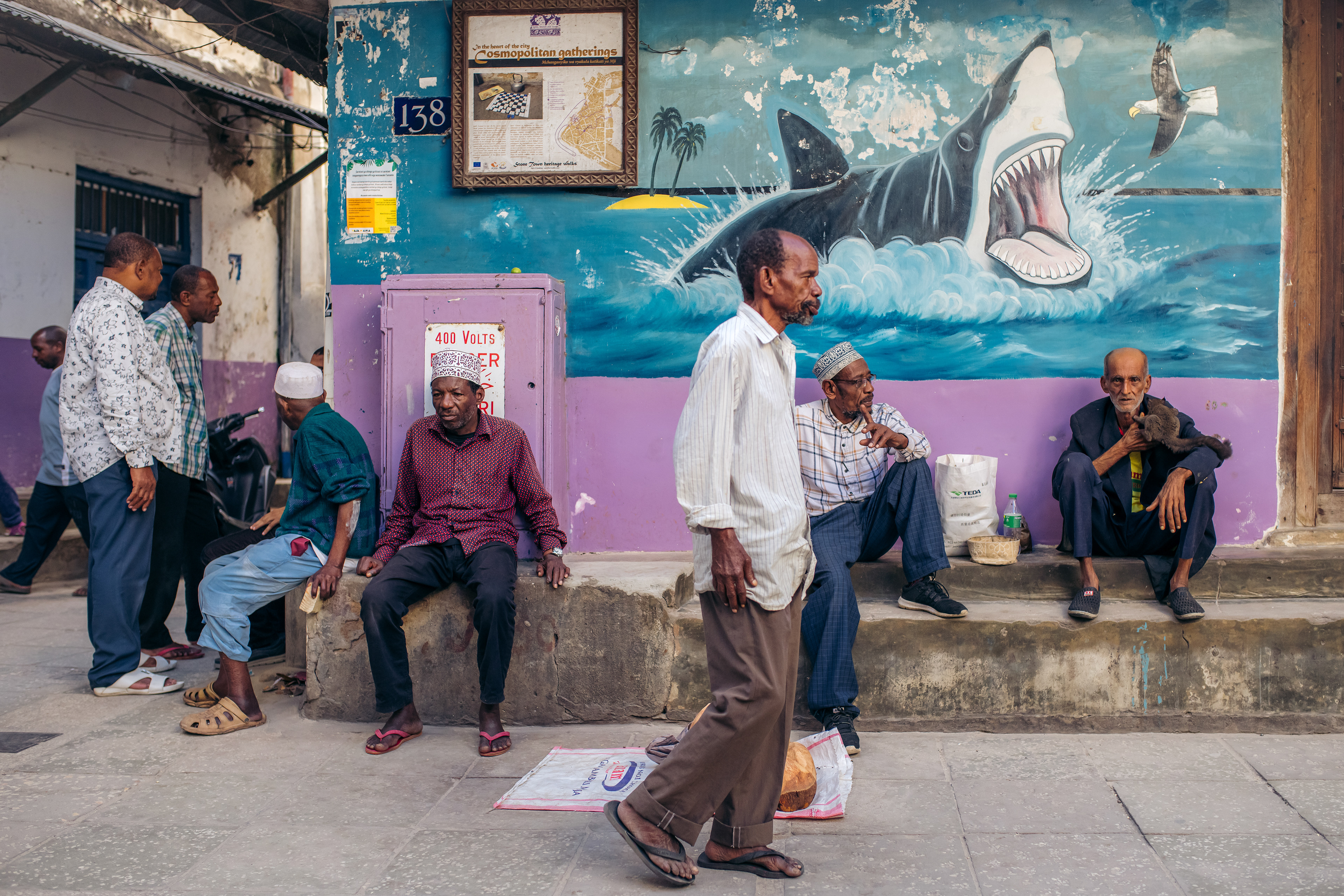 Male dominated corner in a street in Stone Town, Zanzibar. Women are usually not seen in the corner where only men gather to socialize