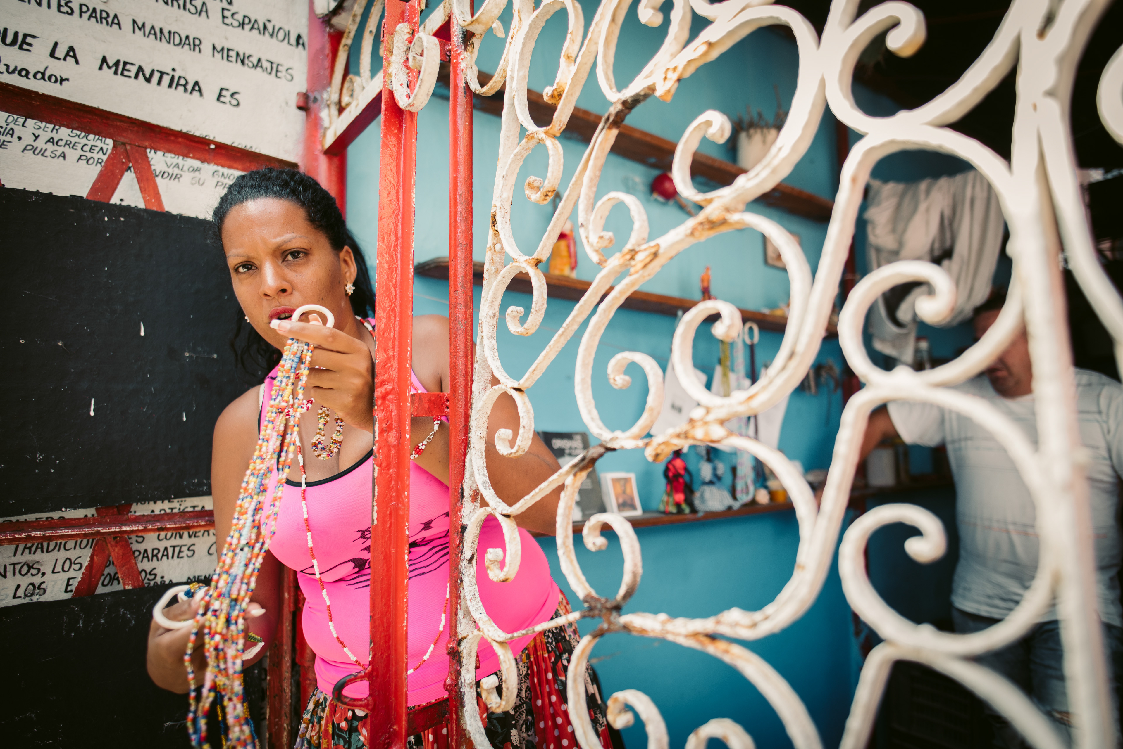 Woman selling Santeria beads in a corner street in Havana, Cuba