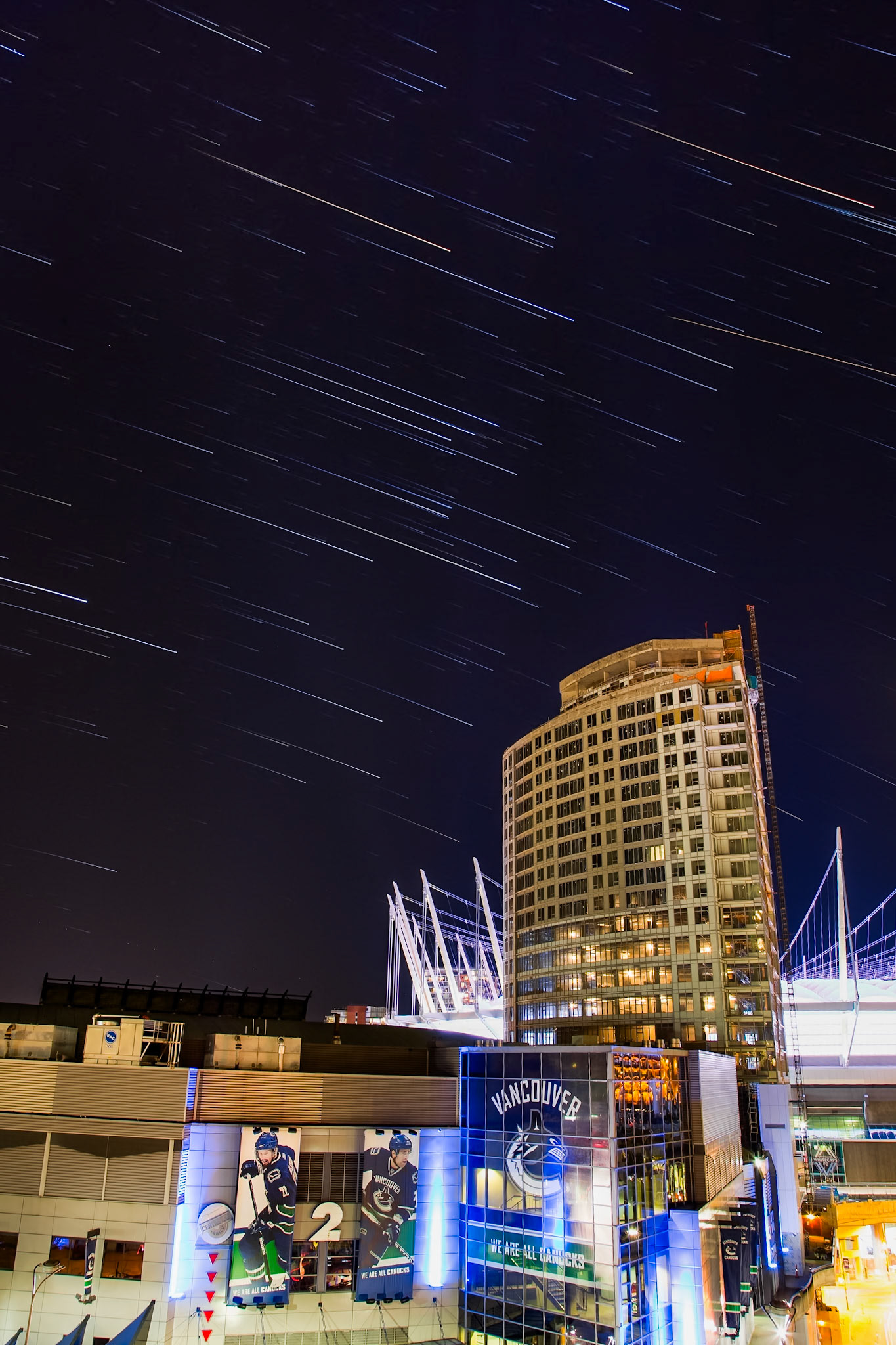 Star trails over Rogers Arena and the city of Vancouver.