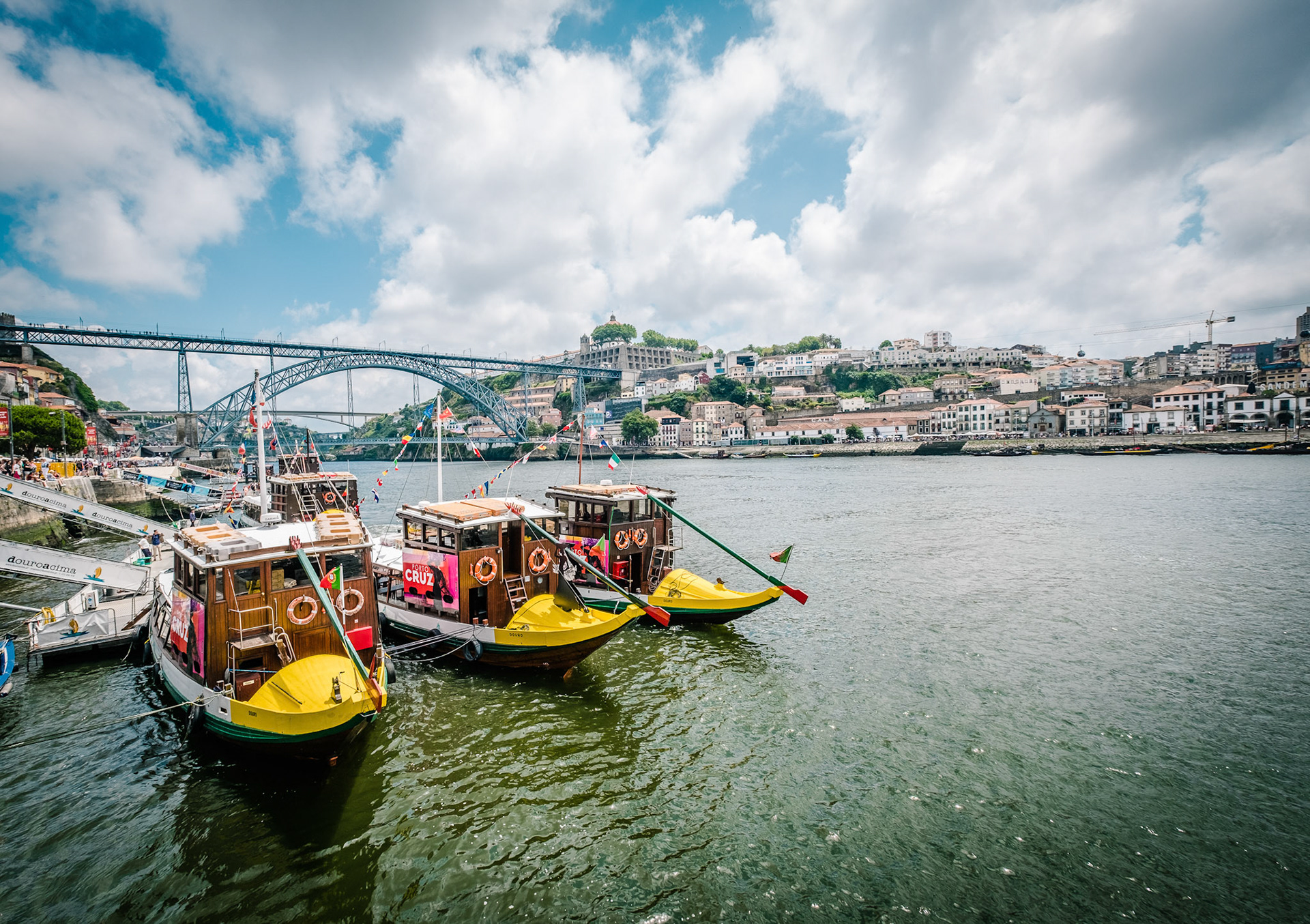 Tourist boat moored on the Ribeira of Douro River. Porto, Portugal.