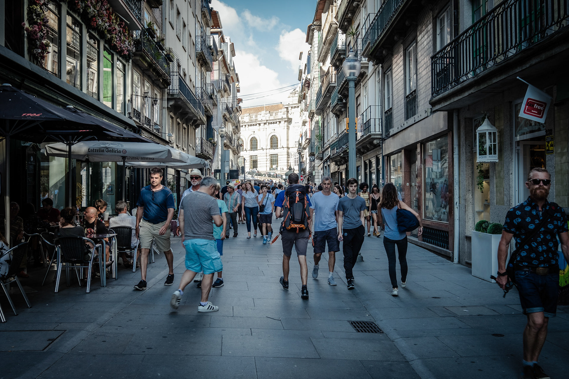 People walking in the beautiful and typical streets of Porto on a summer day. Portugal