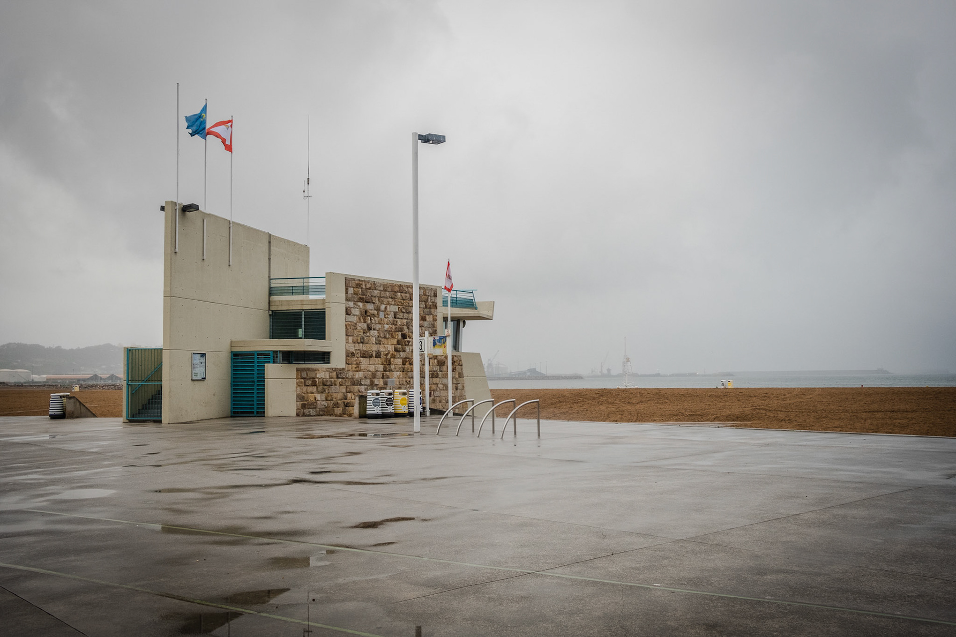 Poniente Beach on a cloudy and rainy day, Gijon Spain