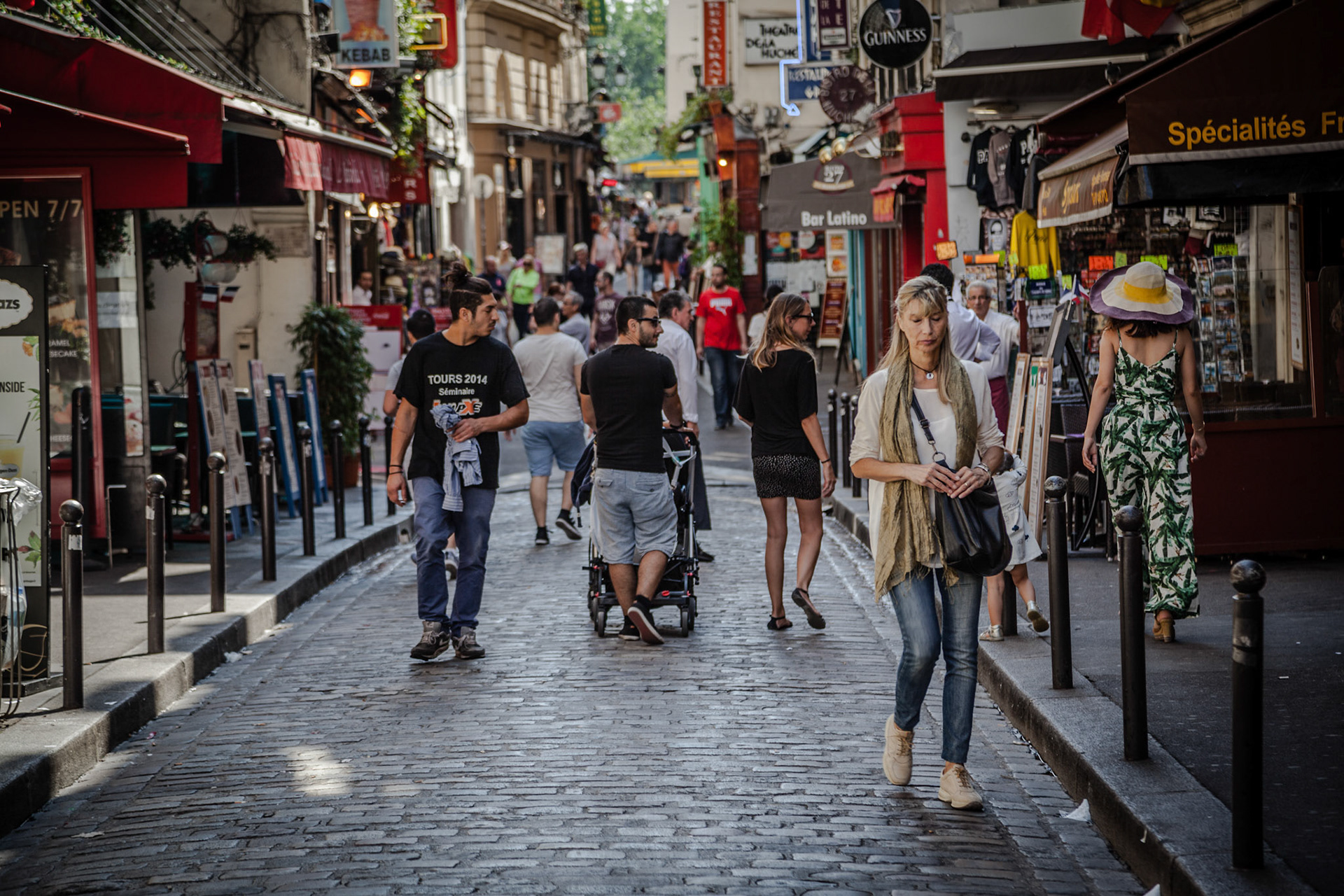 People wlaking in teh streets of Saint Germain, Paris, France