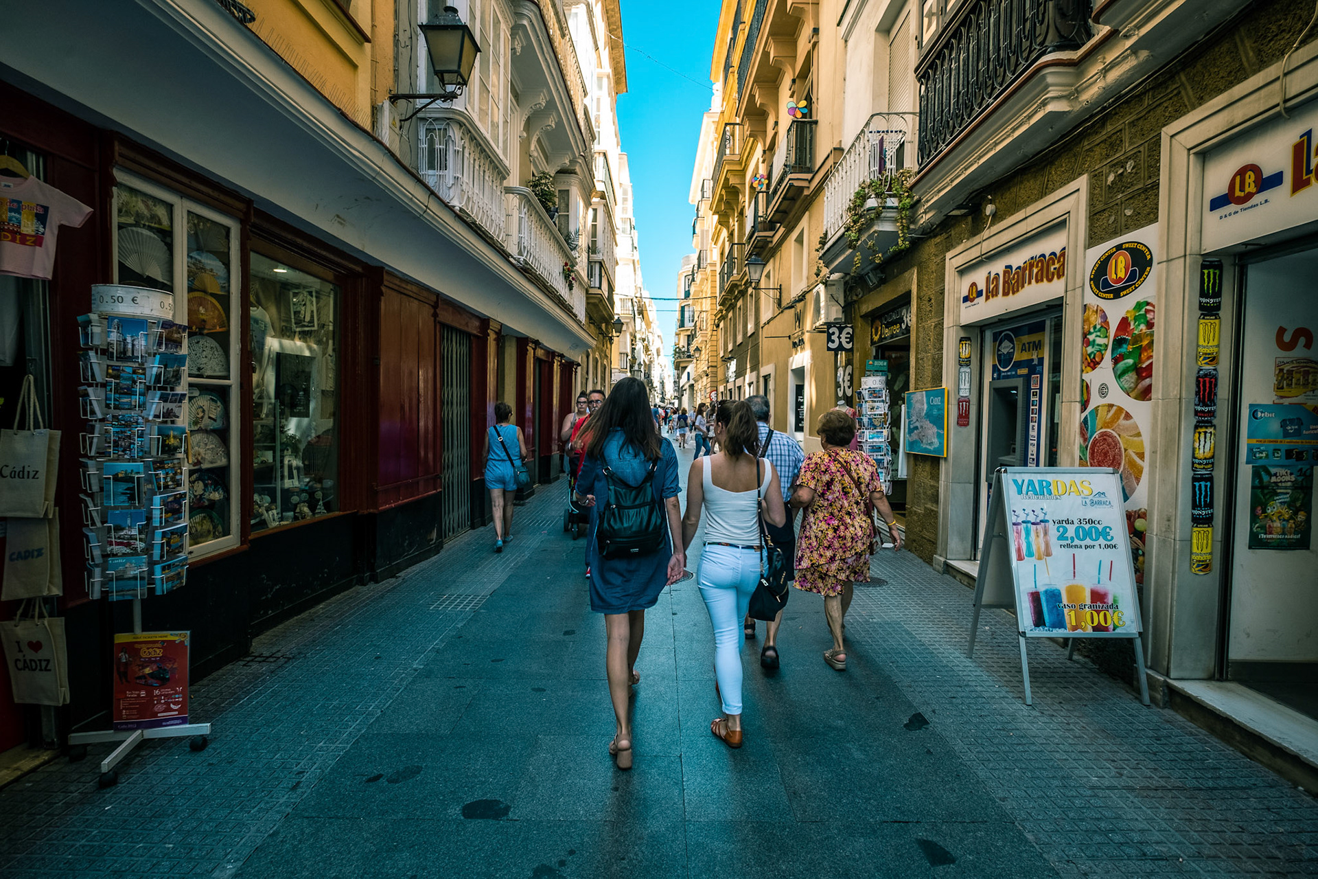 Tourists and locals at the beautiful and historic streets of Cadiz, Spain.