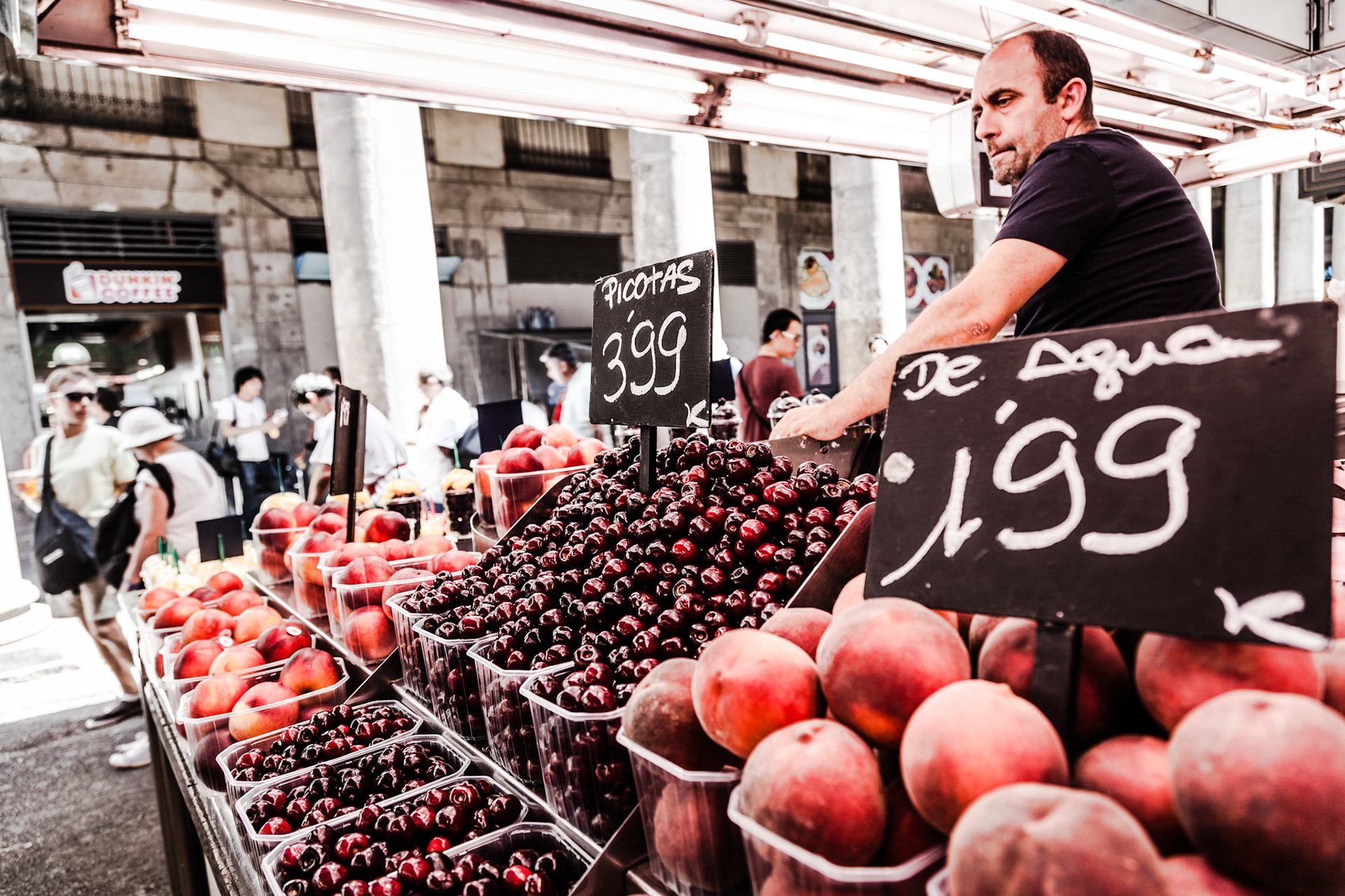 Colourful fruit and figs at market stall in Boqueria market in Barcelona.