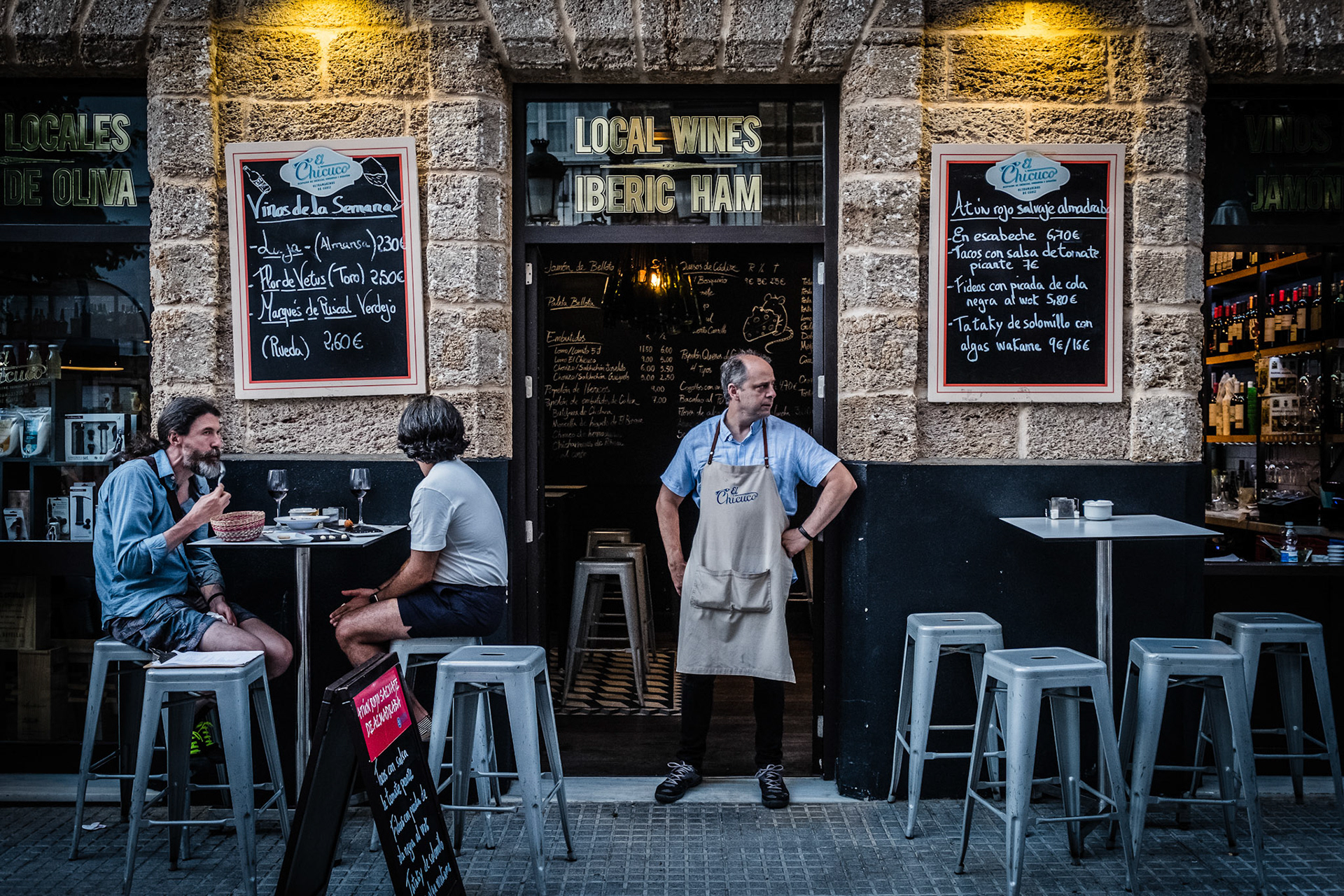Tourists and locals at the beautiful and historic streets of Cadiz, Spain.