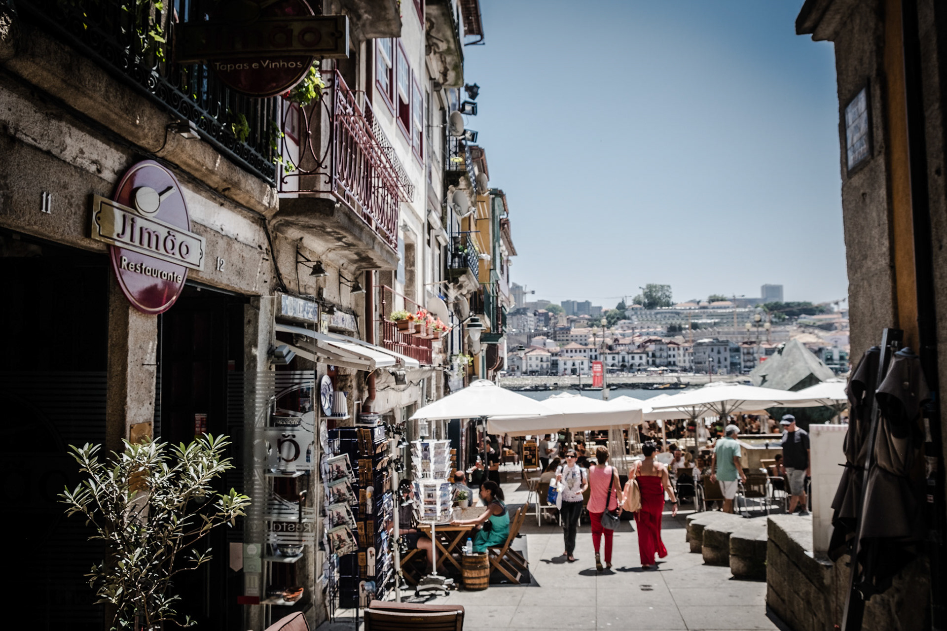 People walking in the beautiful and typical streets of Porto on a summer day. Portugal