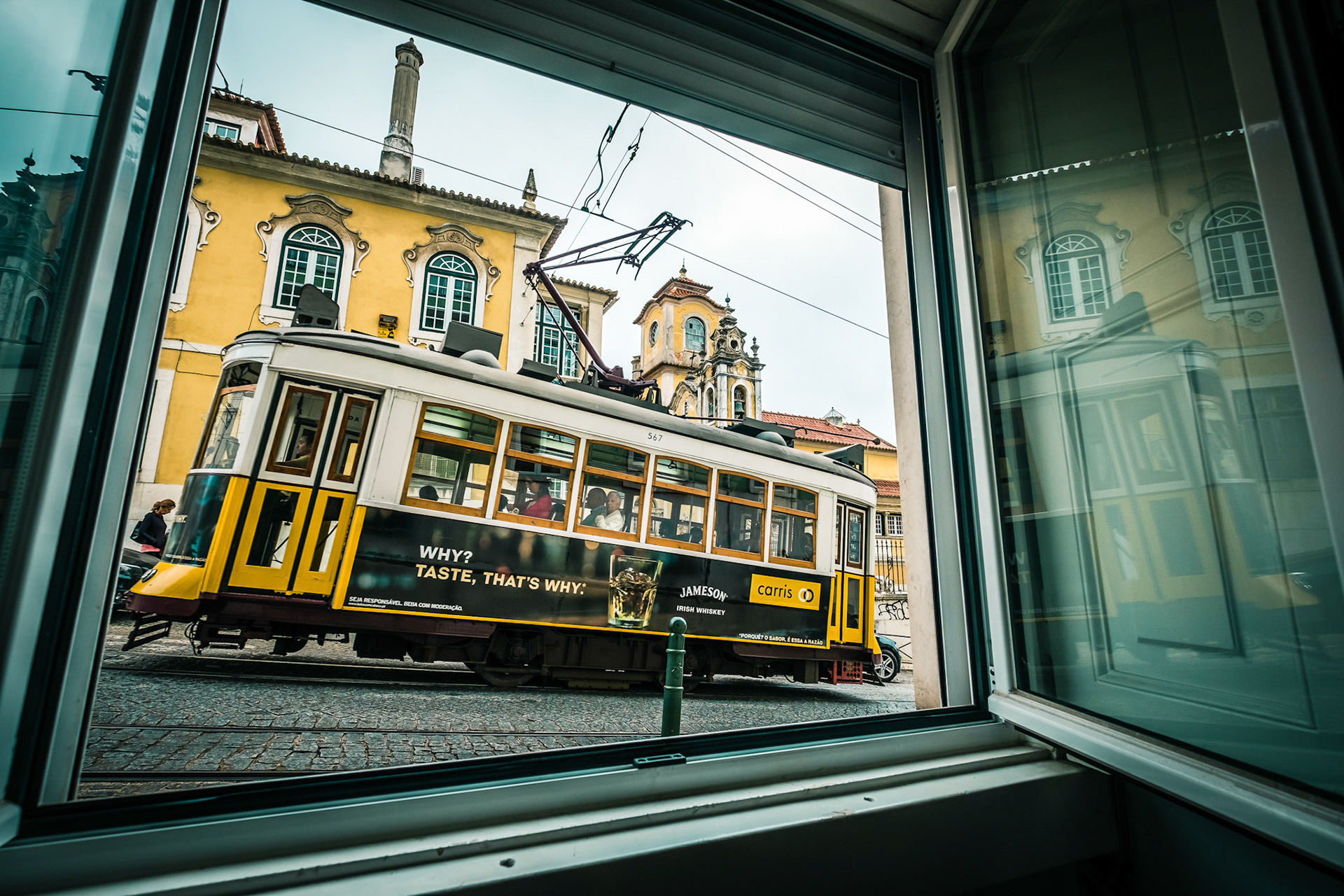 Famous retro yellow tram on the street in Lisbon city, Portugal