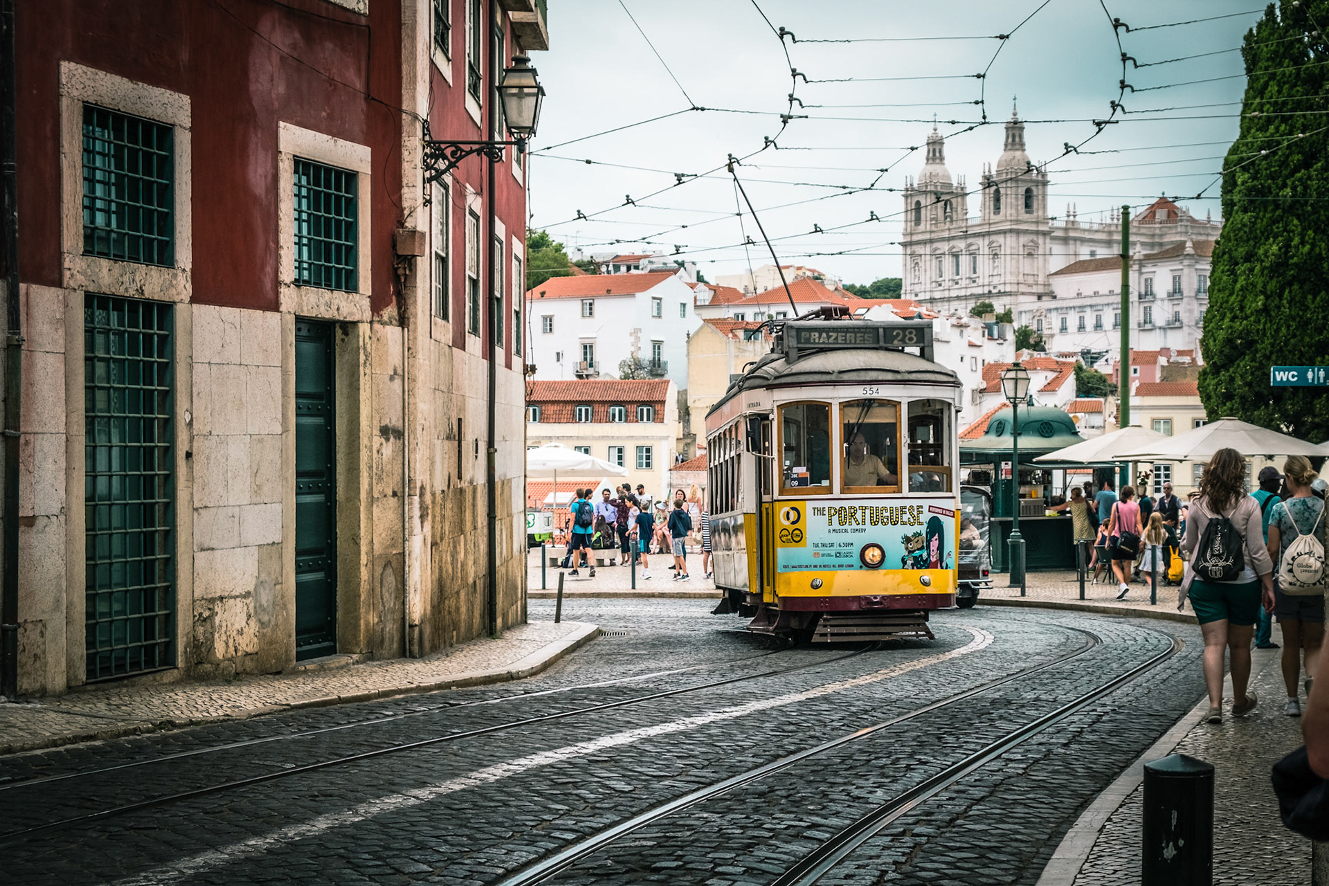 Famous retro yellow tram on the street in Lisbon city, Portugal