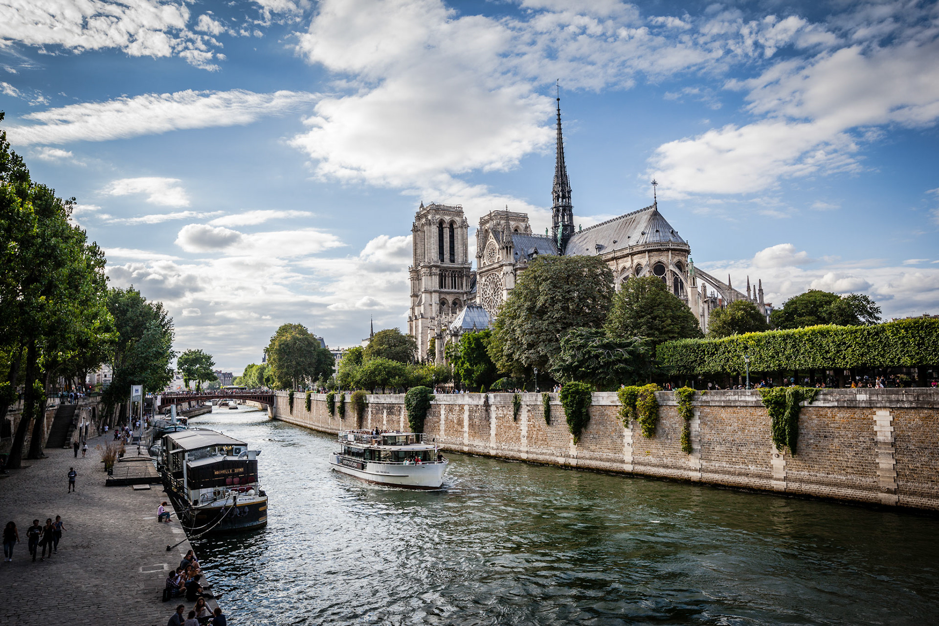 Notre Dame cathedral with puffy clouds, Paris, France