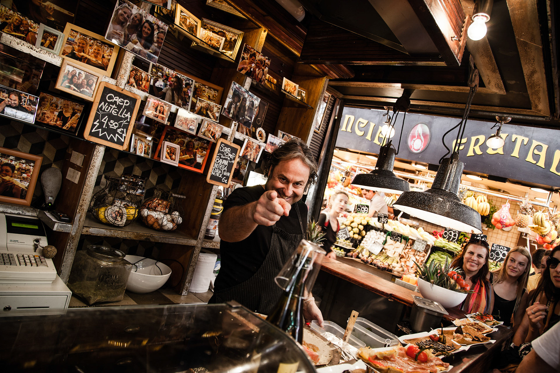 Man sells and prepare crepes at La boqueria, Barcelona