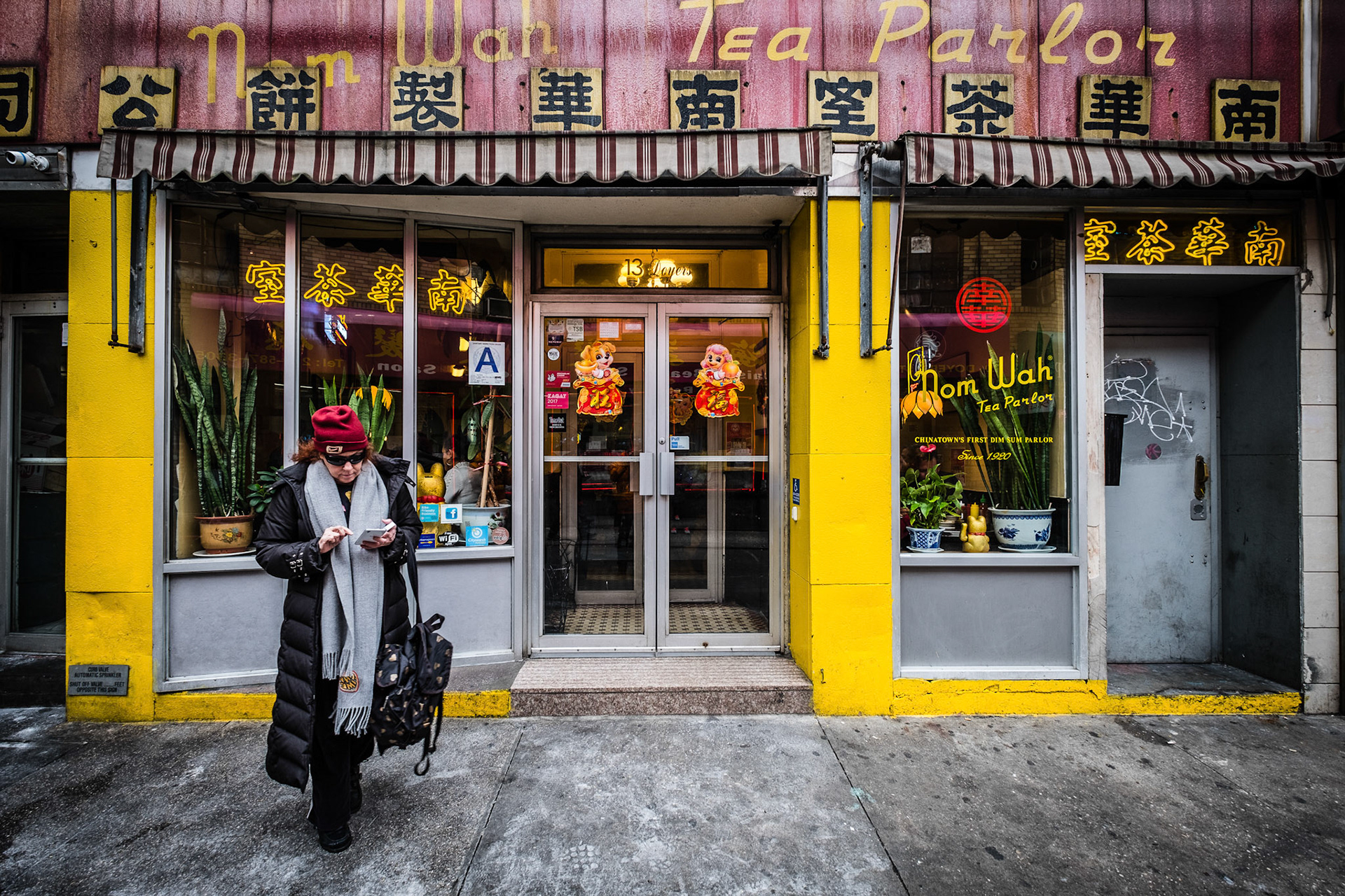 Unidentified people walking the street of Chinatown at New York City.