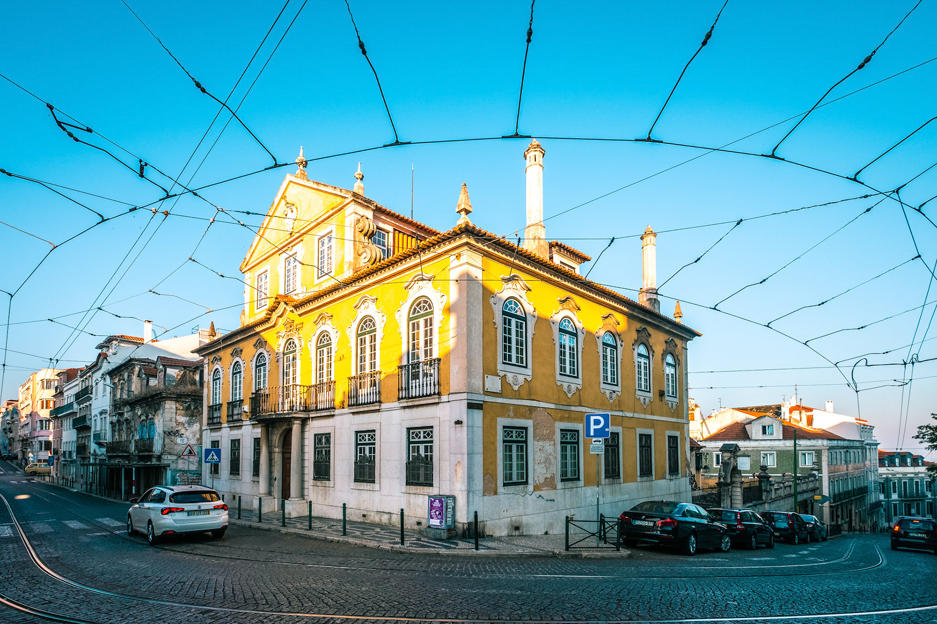 Authentic Lisbon street. The road with the rails along the street. Lisbon, Portugal