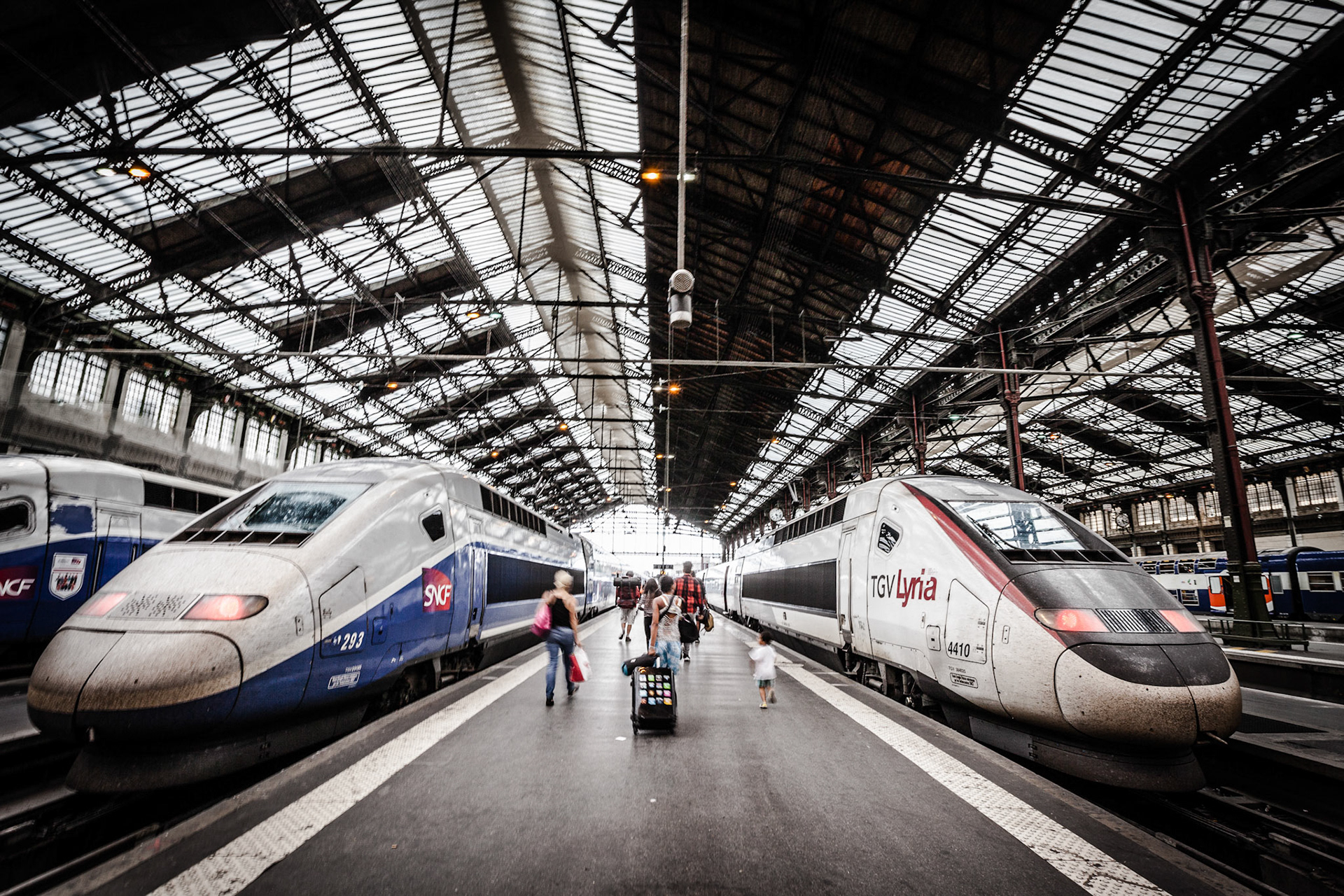 Modern high-speed bullet TGV and regional trains leave Paris from the historic Gare de Lyon station
