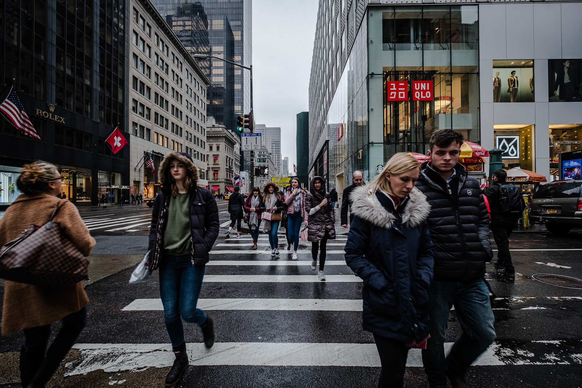 Unidentified people walking the street of New York City.