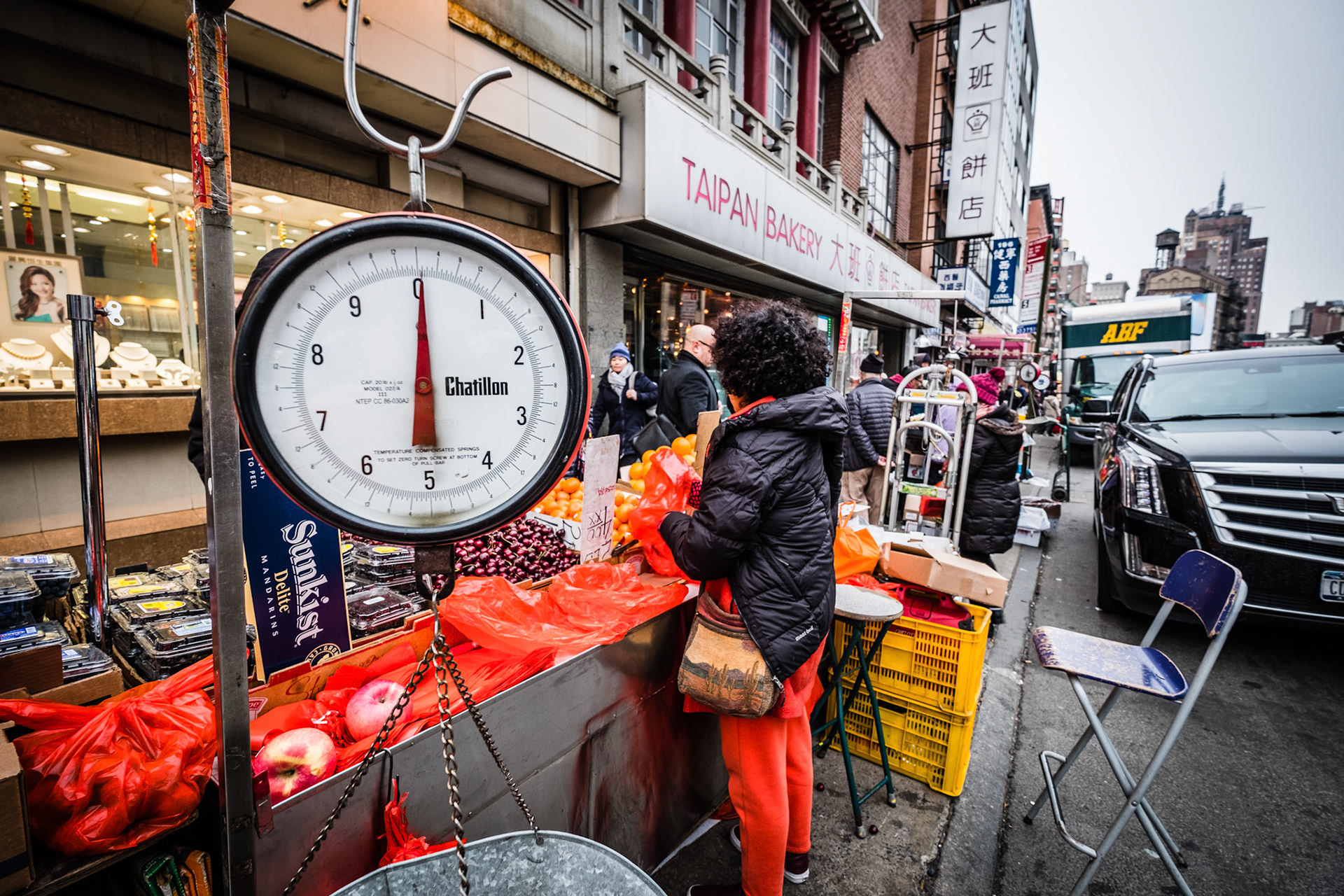 Unidentified people walking the street of Chinatown at New York City.