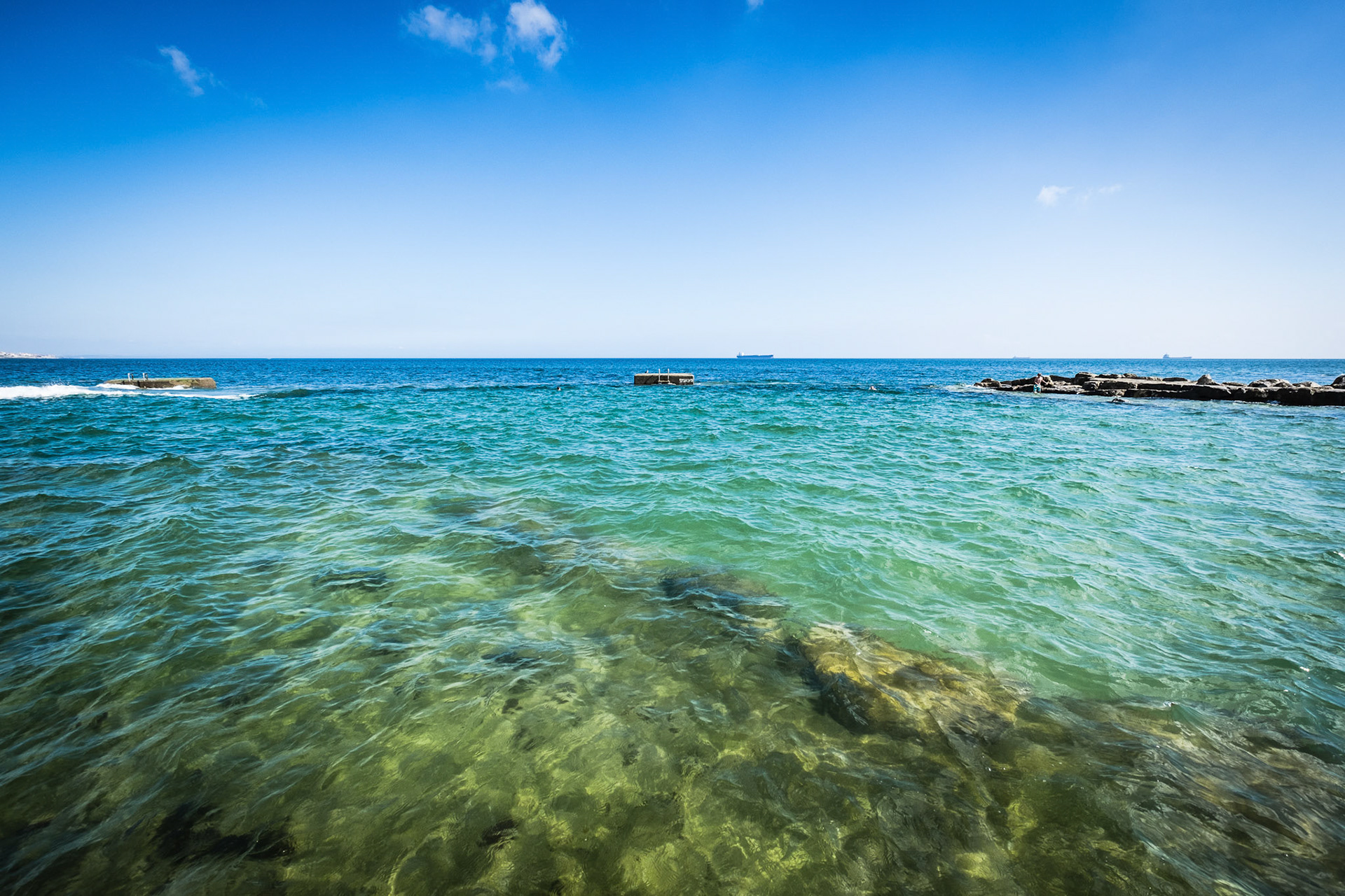 Public beach in Estoril in a beautiful summer day, Portugal