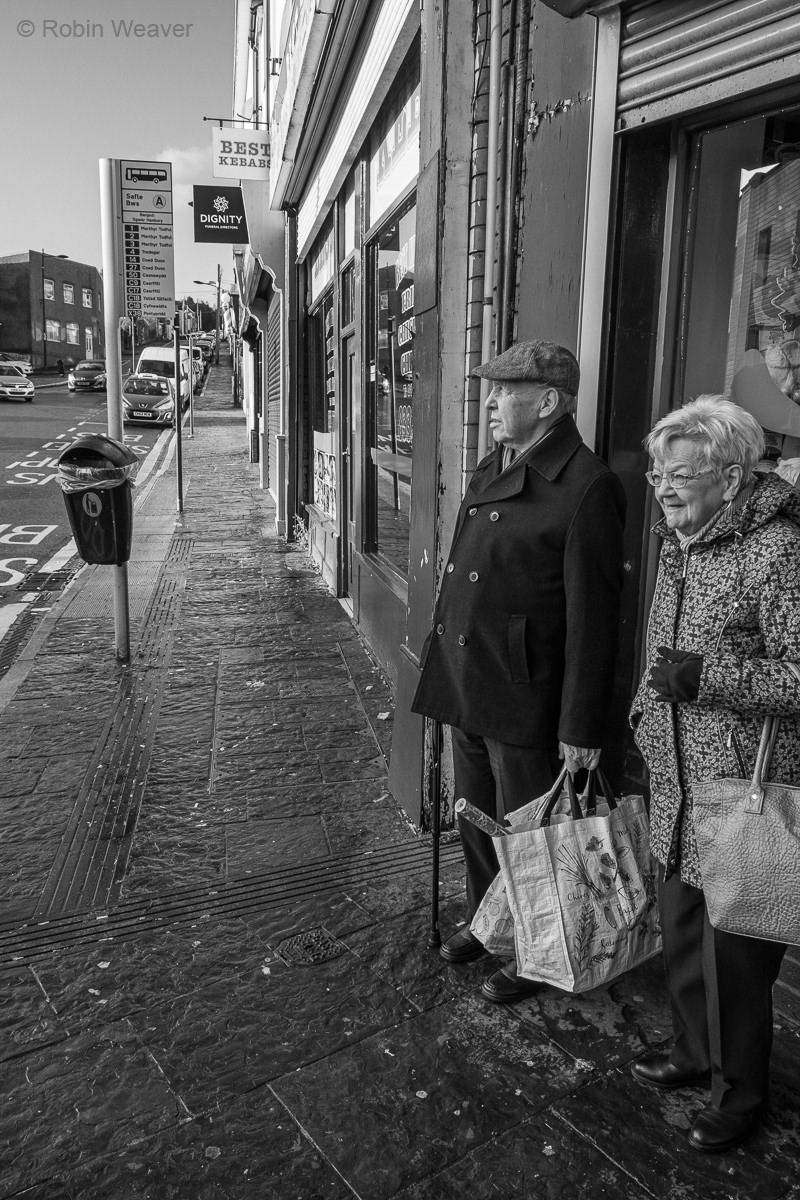 Waiting for a bus, Hanbury Square, Bargoed, 2019