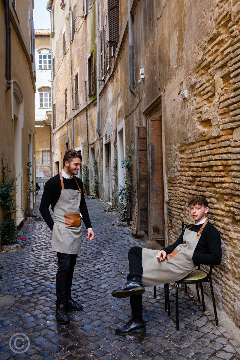 Restaurant waiters having a break in the Jewish Quarter, Rome