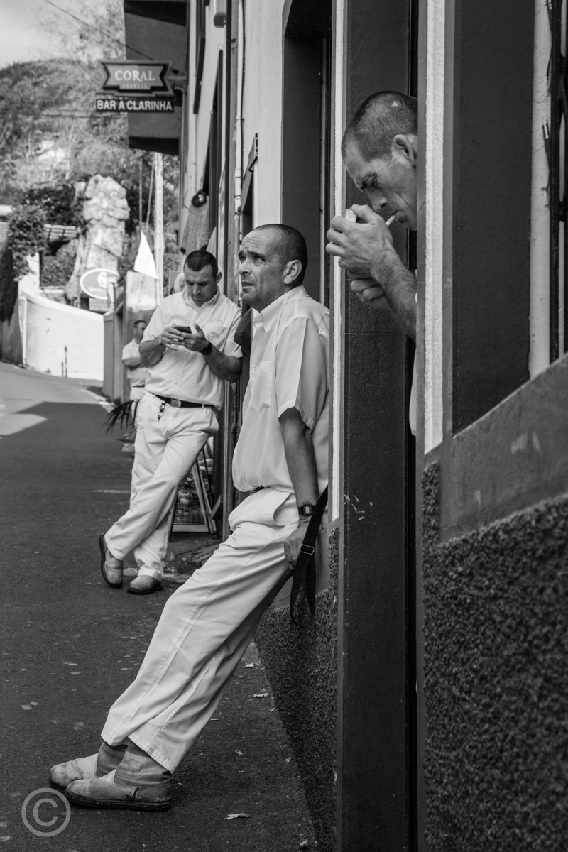 Carreiros resting between toboggan rides, Monte, Madeira