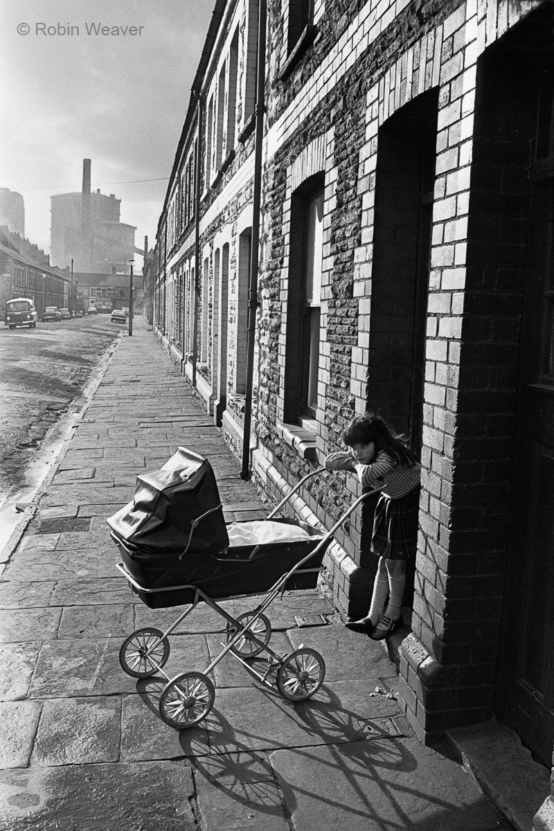 Girl minding a baby, Splott, Cardiff, 1974