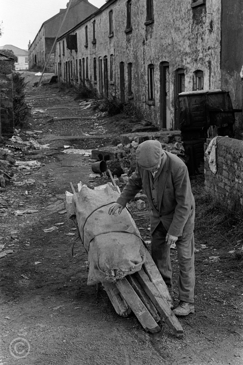 Collecting scrap wood from derelict ironworkers' cottages, Blaenavon, 1972