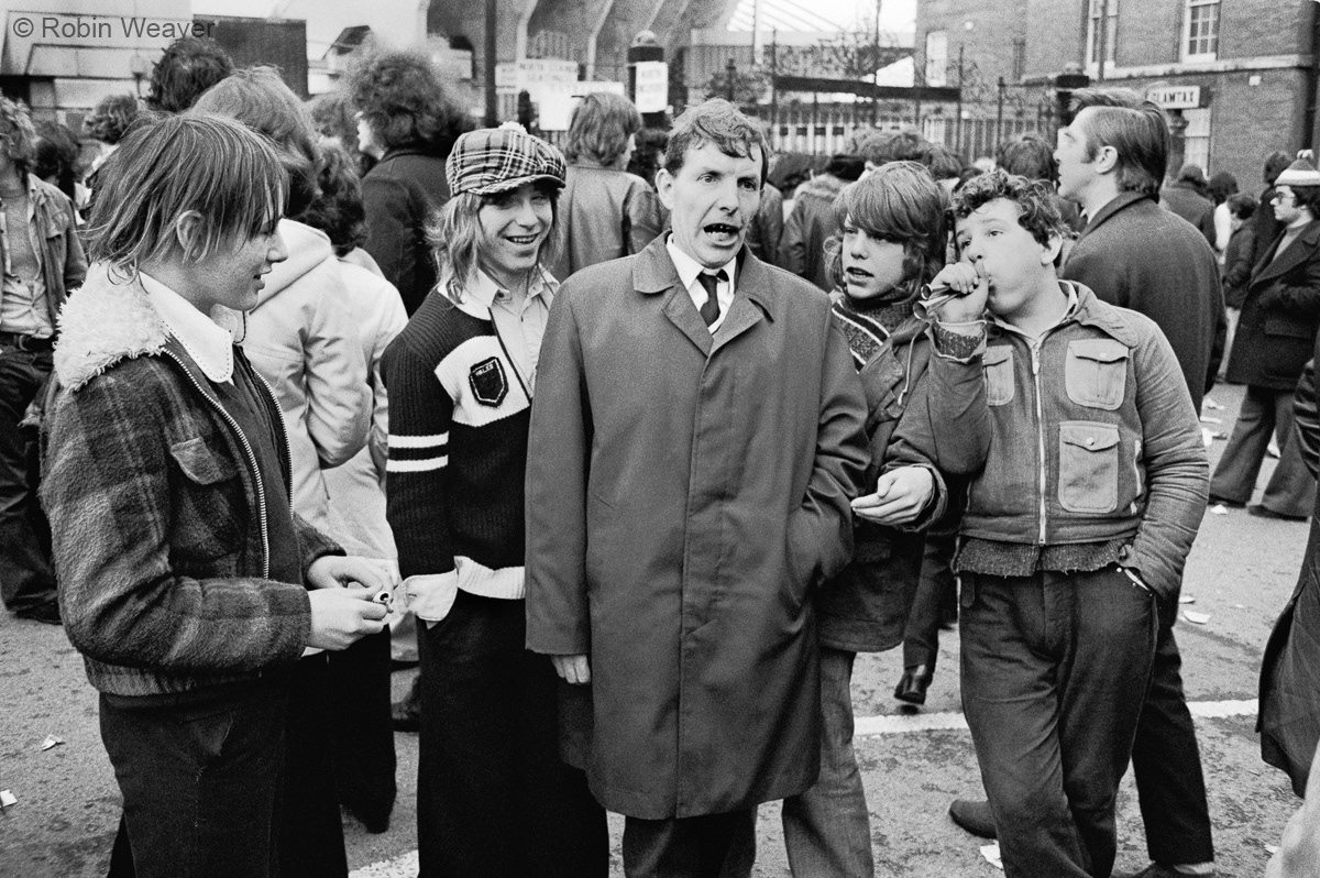 Rugby fans mocking a street preacher outside Cardiff Arms Park, 1974