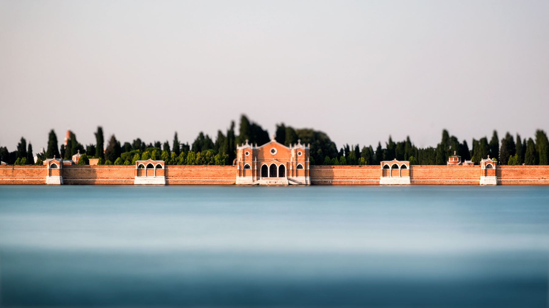 Blurred seascape in front of Venetian island.