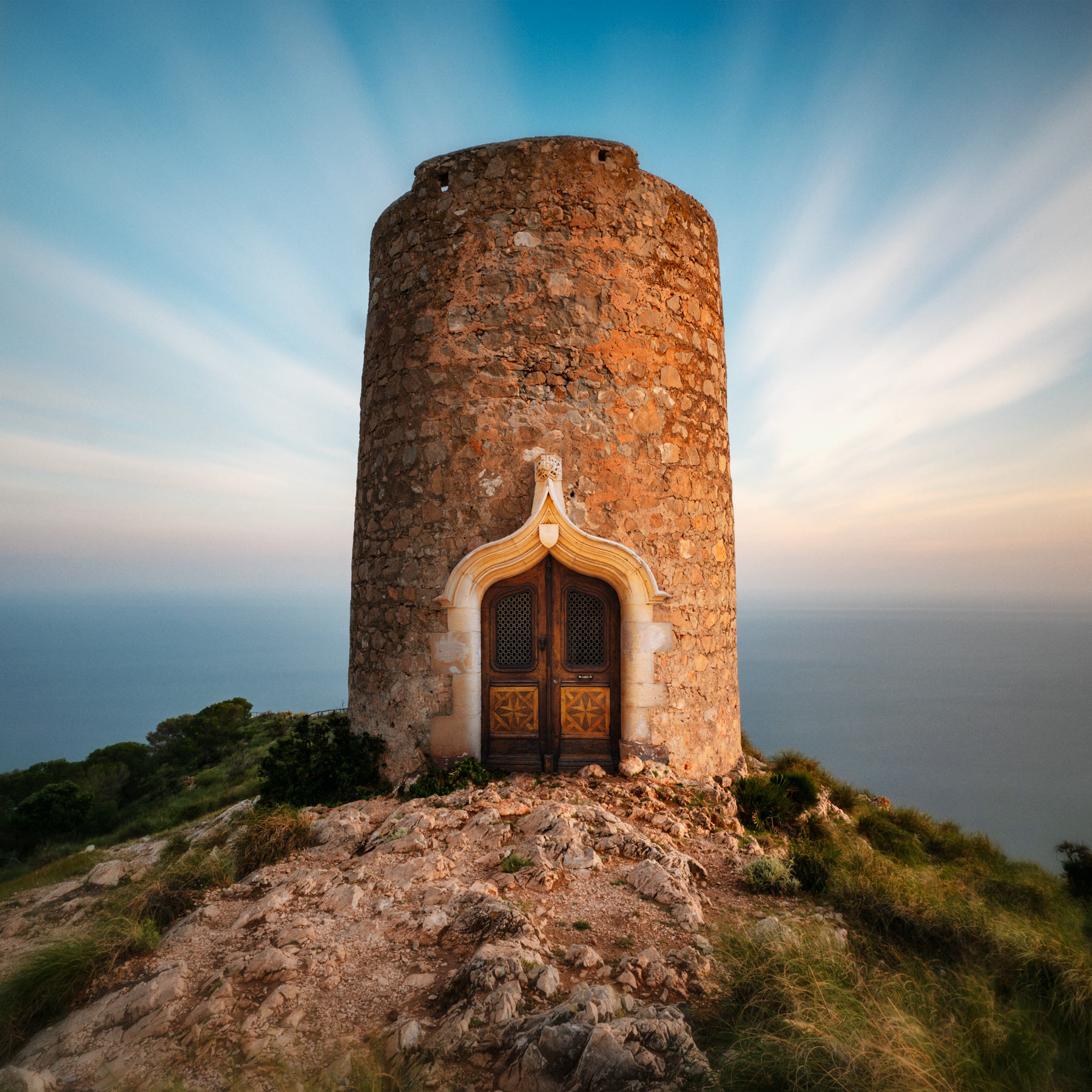 Stone guard tower, perched on a cliff edge.