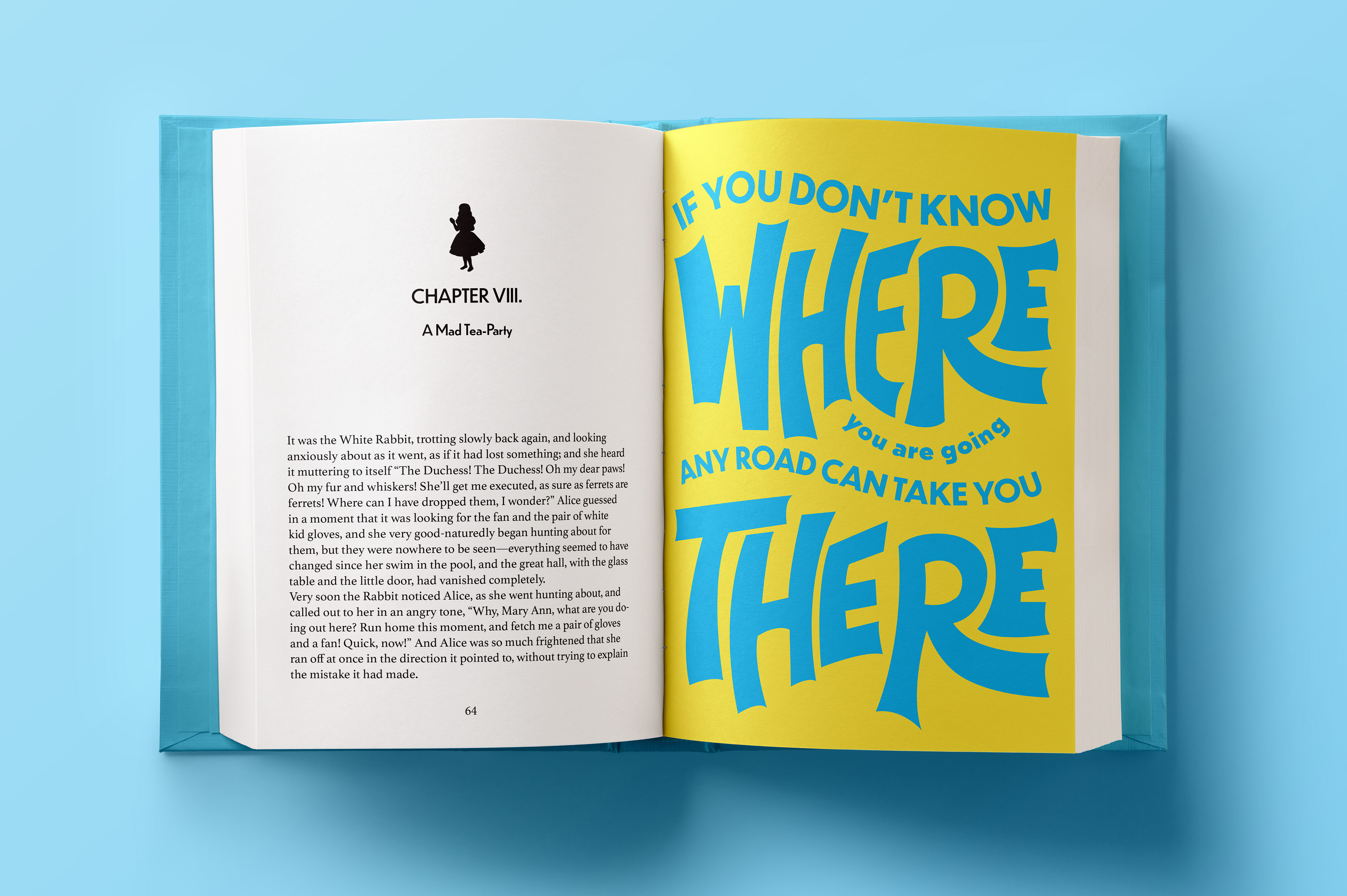 Open book with typographic illustration that says "If you don't know where you are going any road can take you there".
