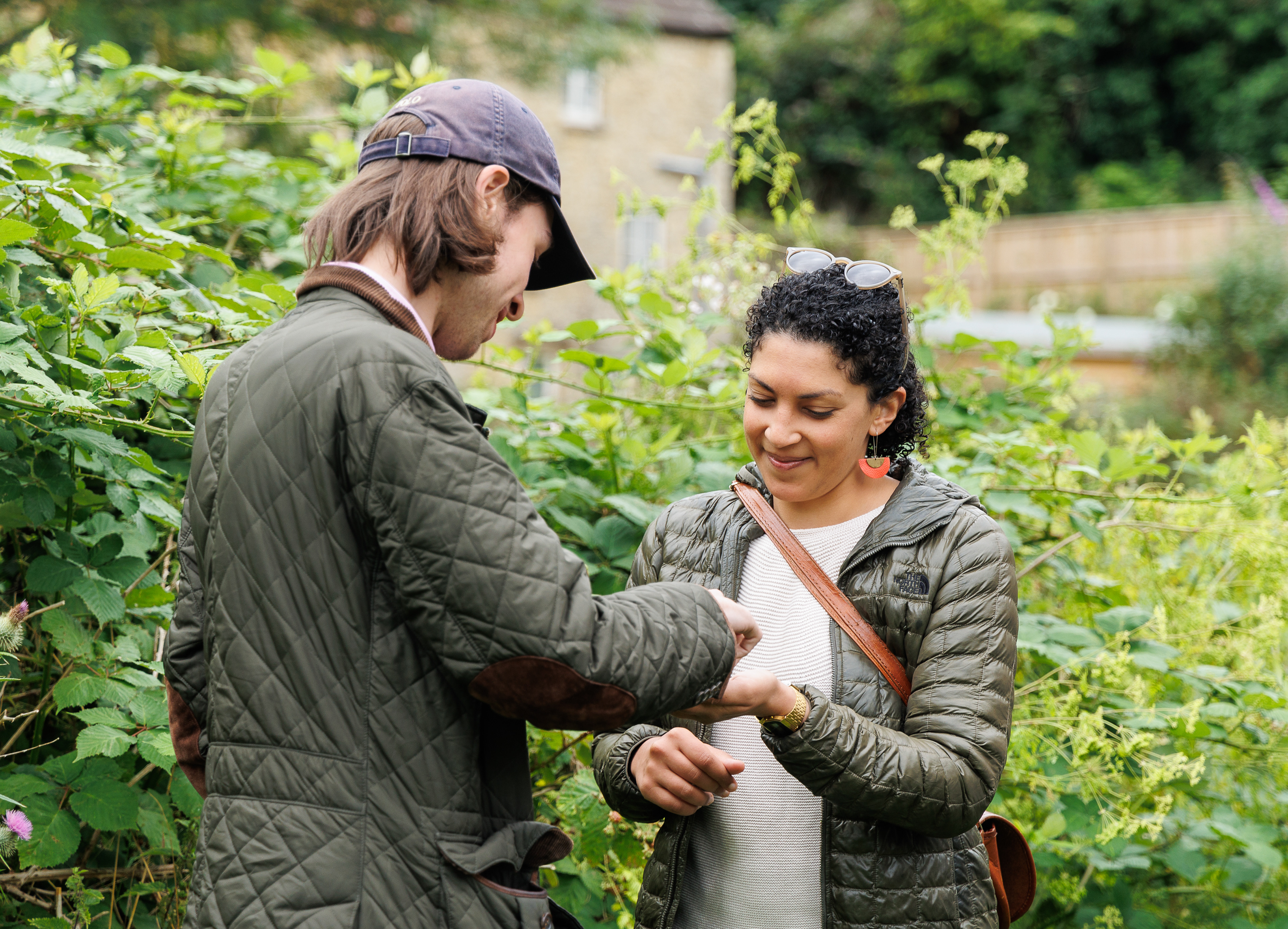 Pepijn offers Ava a blackberry in Malmesbury 