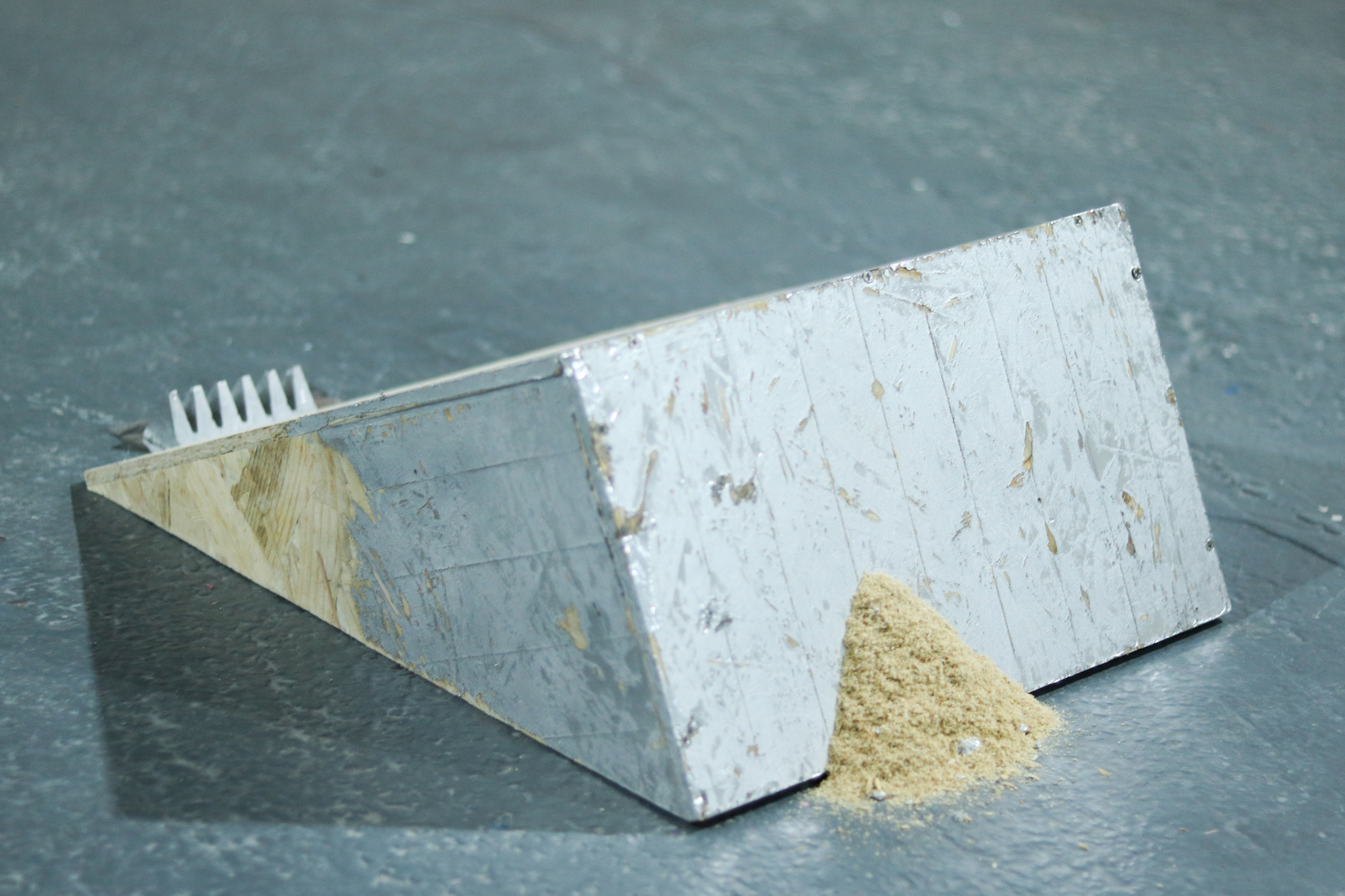 osb shelf, aluminium toblerone, aluminium tape, aluminium foil with text, sawdust