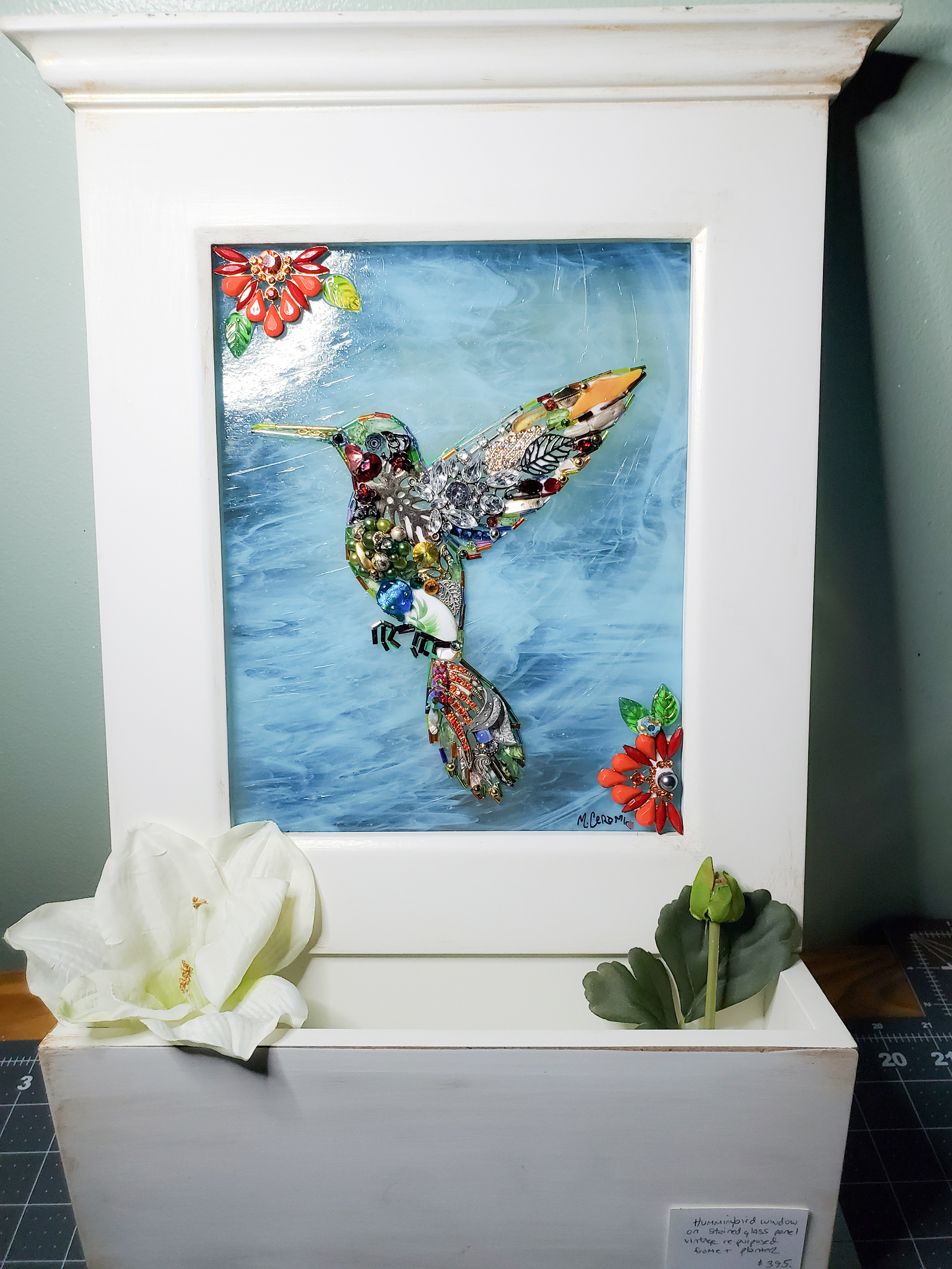 SOLD - Hummingbird on hand-cut stained glass in frame. Compartment can be used as a planter or for letter-box.