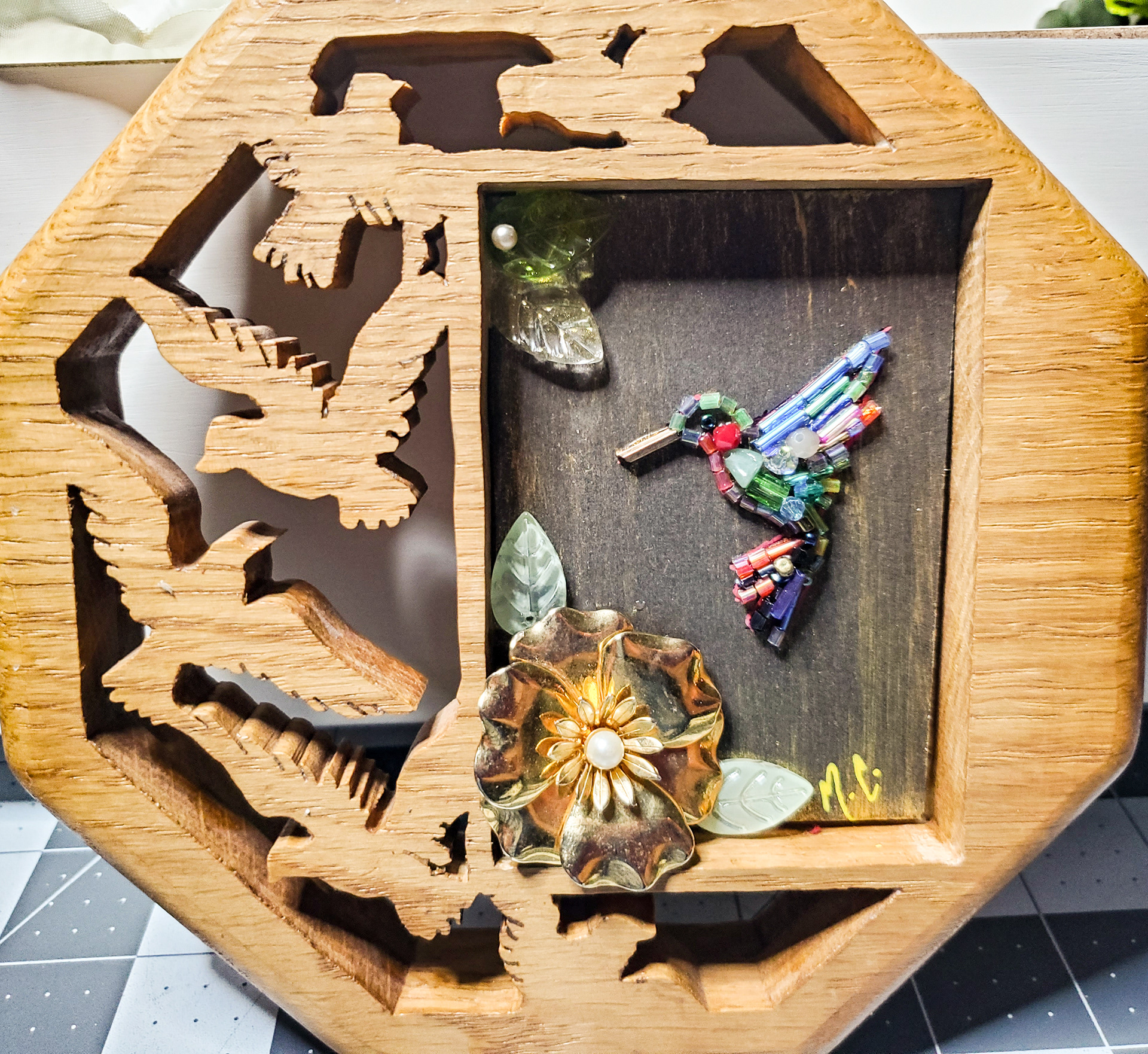 Tiny hummingbird in vintage handmade wood frame. Hang on the wall, or this frame stands on its own.