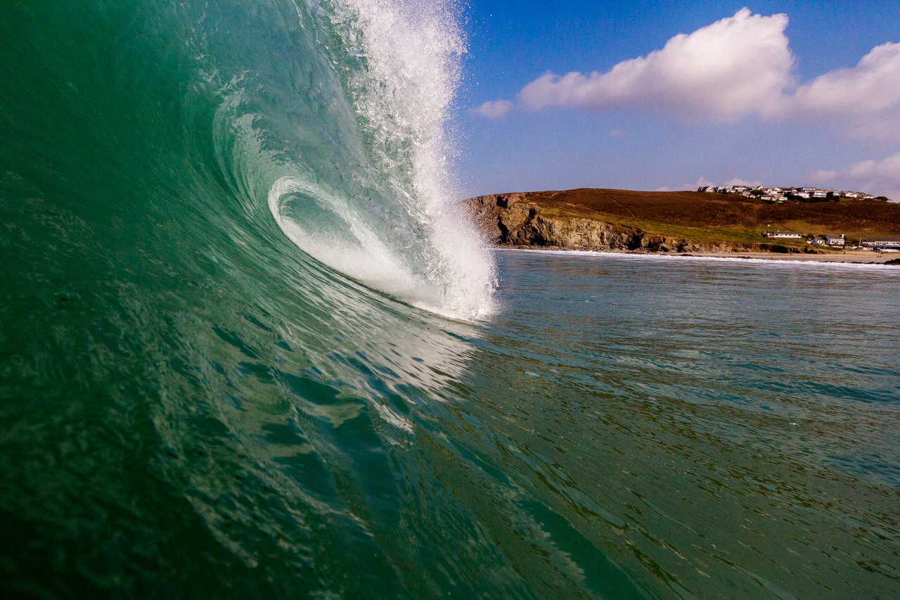 perfect barrelling blue wave at Porthtowan, Cornwall